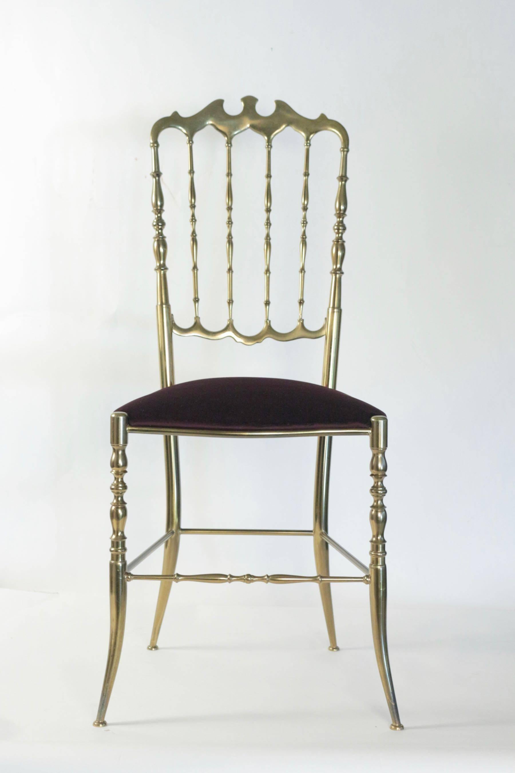 1950s pair of brass Chiavari chairs. 

Elegant Italian Chiavari chairs. Skillfully crafted solid brass structure. 
Remade upholstery and fabric with dark purple velvet. 

 