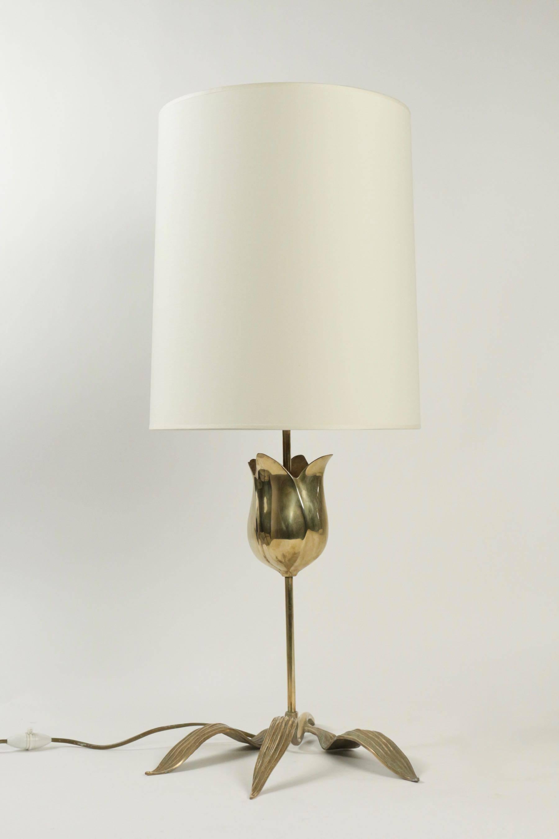 1970s Brass table lamp attributed to Chrystiane Charles. 

All made in brass, the base is composed by three elongated leaves. 
The central stem is adorned by a large tulip flower with a shiny finish. 
Hand made lampshade made of off-white