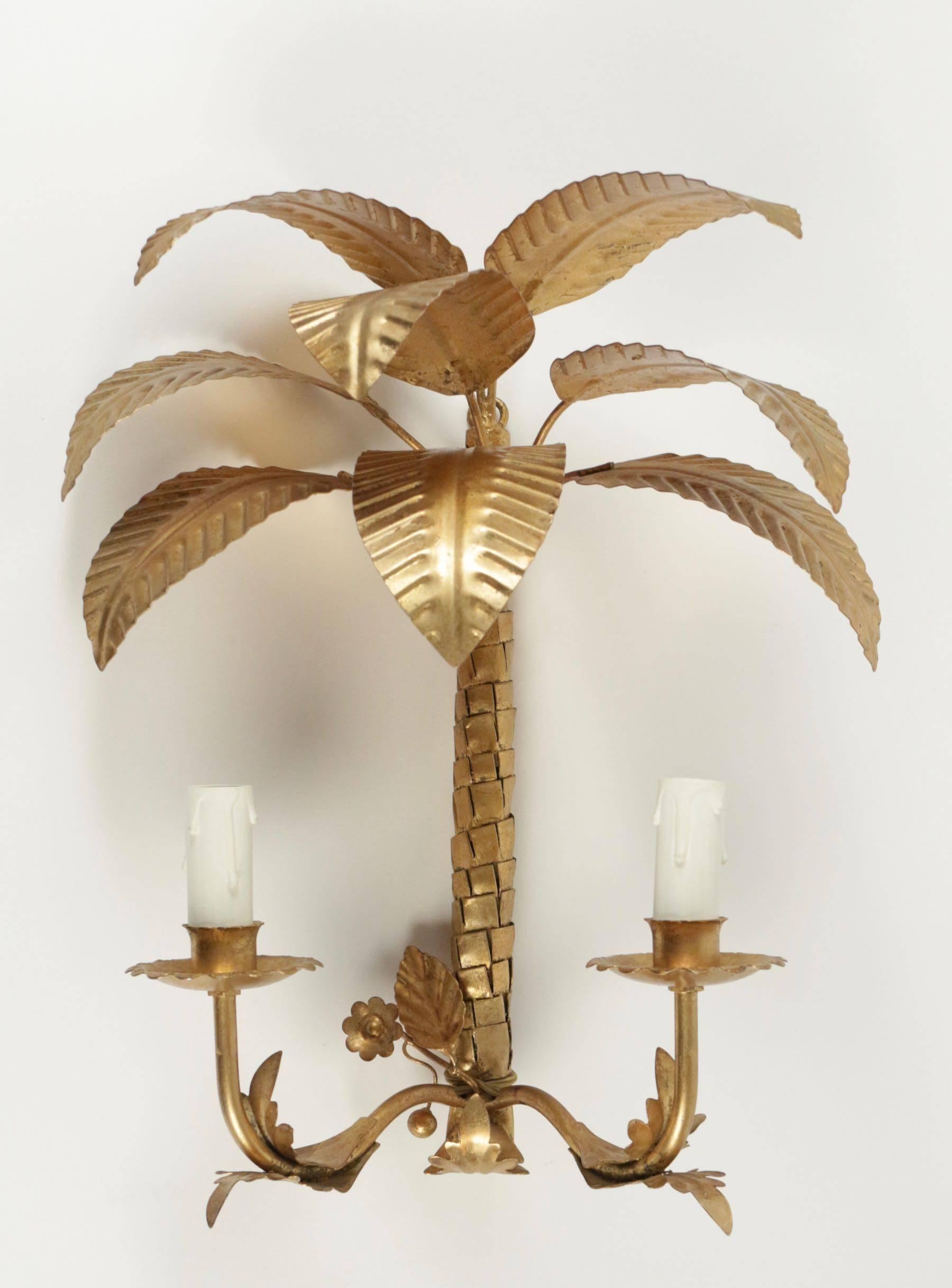 1960s set of three palm leaves sconces Maison FlorArt.

The sconce are made of gilded metal.
Eight palm leaves, textured palm trunk 
Two lighted arms.