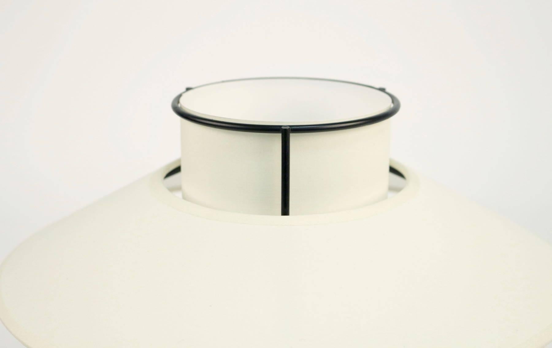 1950 Jacques Biny attributed modernist lantern table lamp
Made with black iron stem.
Handmade lampshade of white ivory cotton, granted to the original.
Minimalist and modernist design, design inspired by the Japanese lanterns.