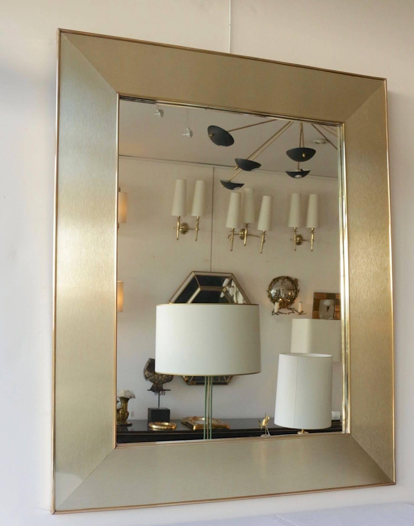 1970s Maison honnoré gilded steel and brass mirror

The mirror is composed with satin gilded steel plates, framed with brass sticks.

  