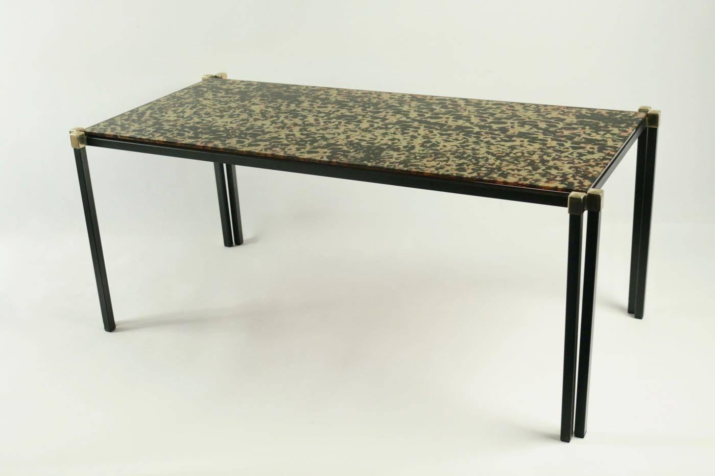 1960s Maison Honore low table eglomized glass plate.

The table structure is made of black lacquered steel ended with brass squares.
The table plate is made of gold and black eglomized glass.

 
