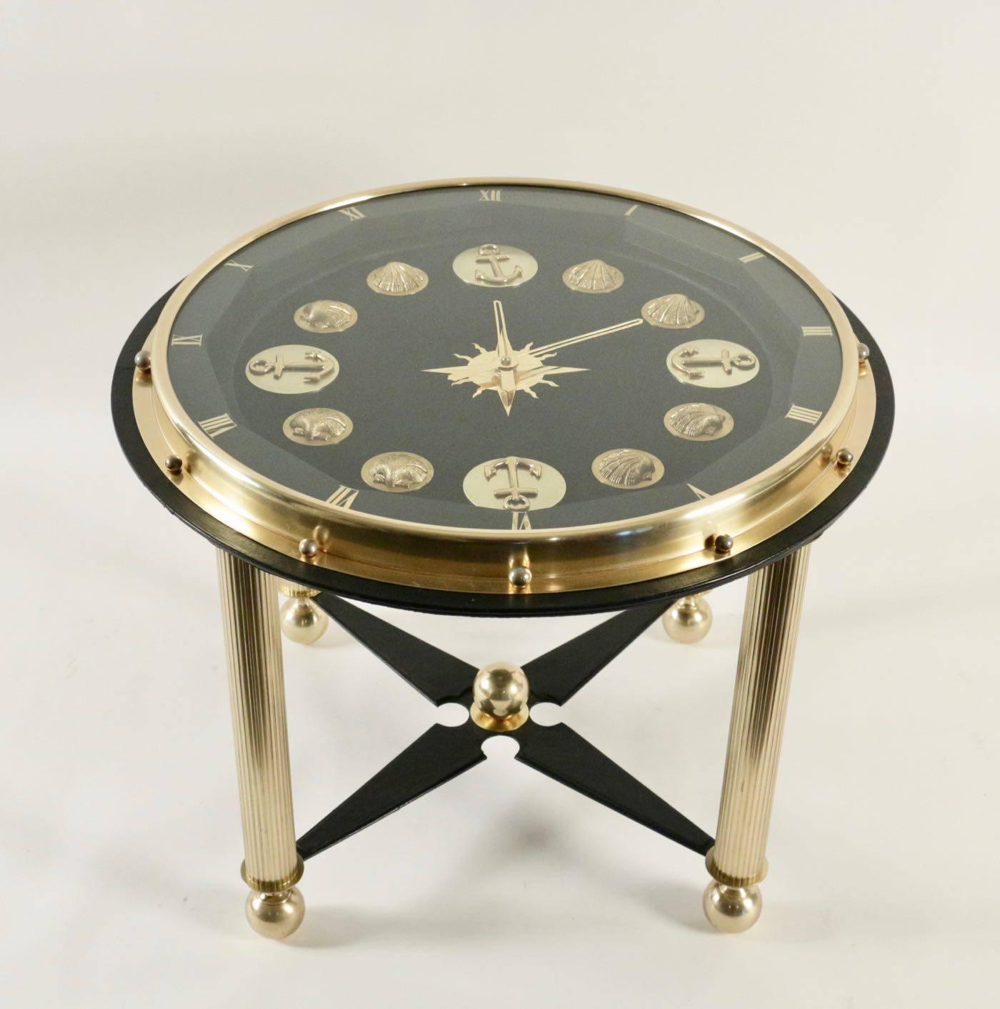 Rare Jacques Adnet Marine clock gueridon. A fancy clock table around the theme of the Sea or Côte d’Azur.
The plate which is also the whole of the clock is decorated with ancors and scallops shell. The clock mecanisme works with 15 jewels