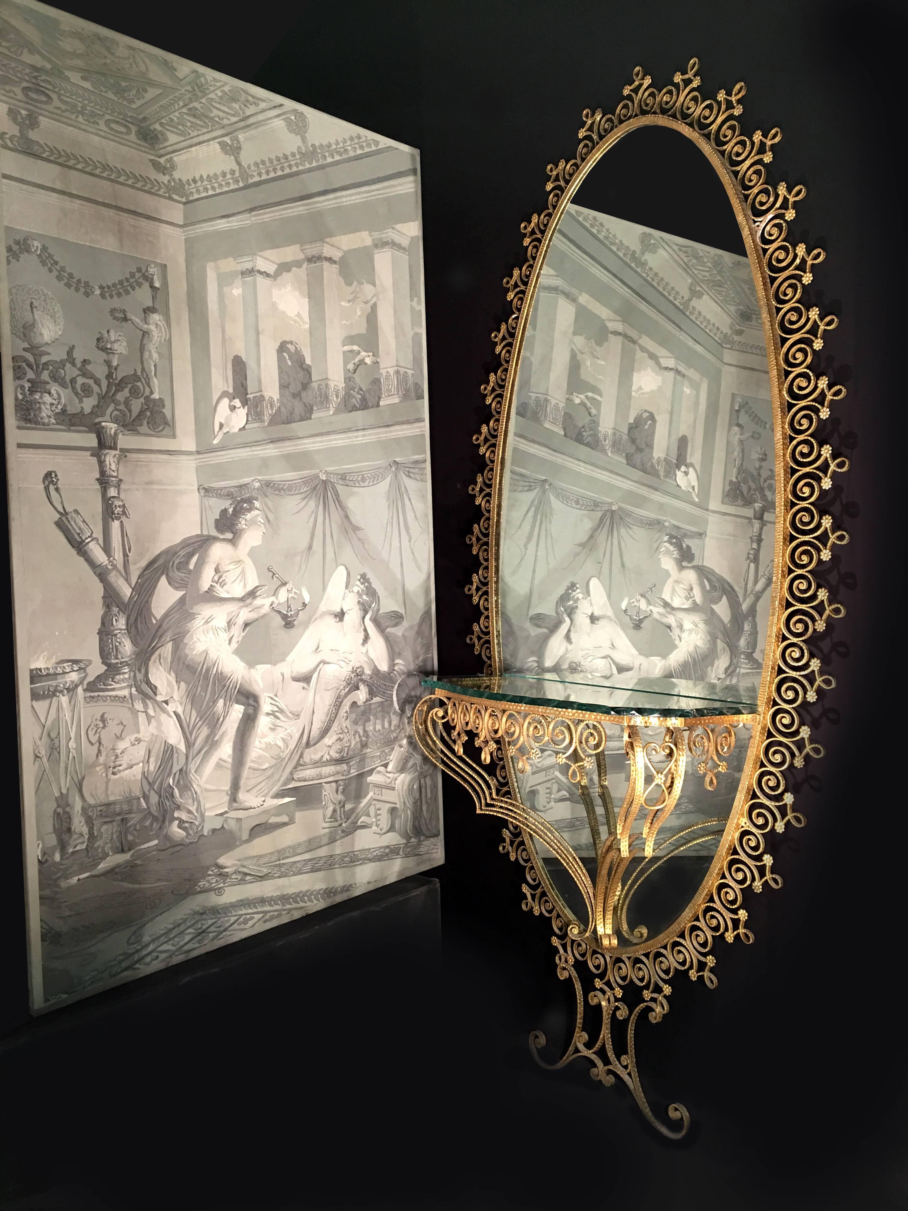 Italian gilt-metal console table and mirror by Pier Luigi Colli, circa 1950s-1960s, a monumental mirror having a "verde nilo"  green glass top.


240 cm H x 110 cm W.