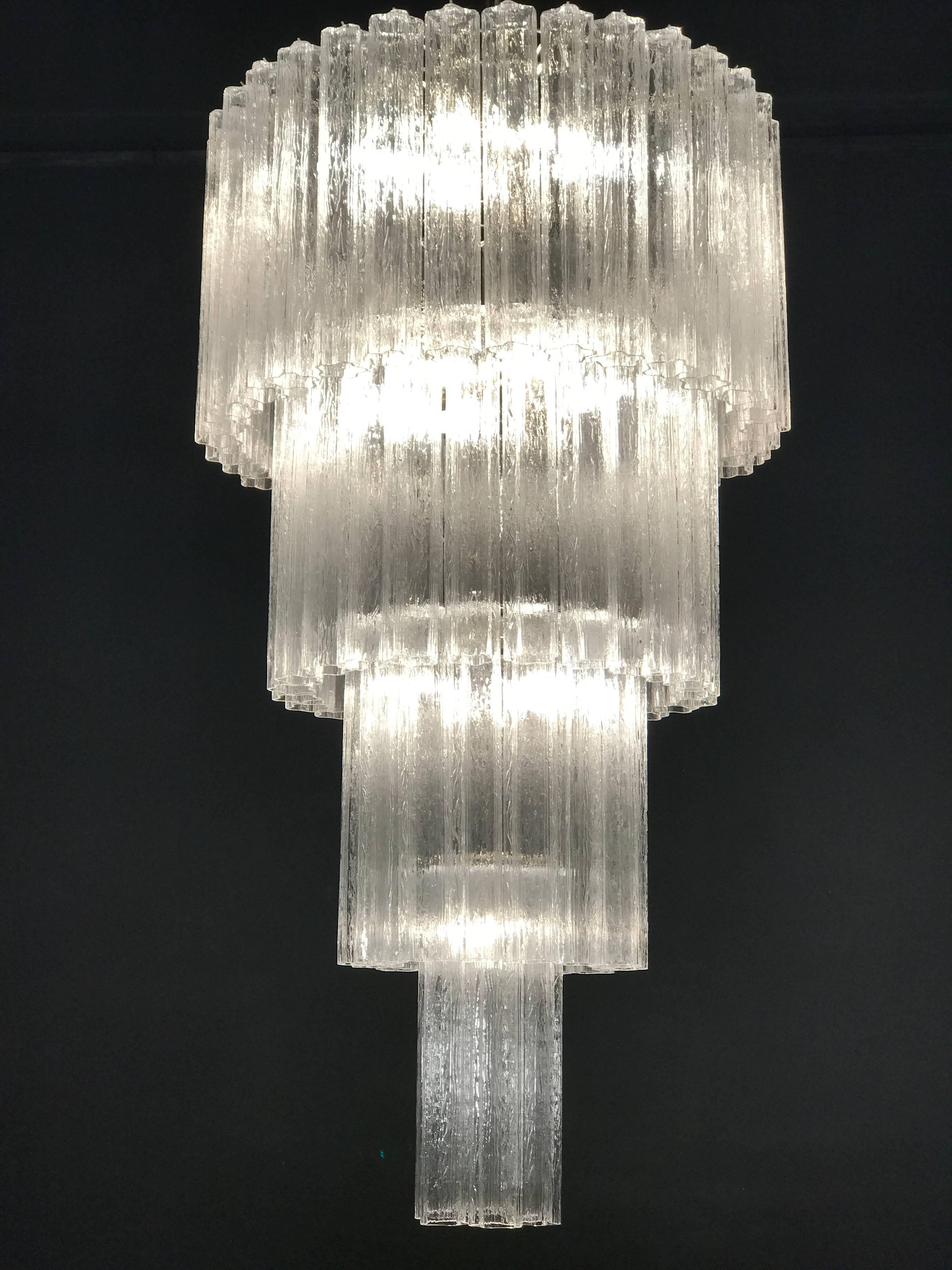 This extraordinary pair of chandeliers is composed by 78 'Tronchi' by 45 cm high.
Eighteen-light bulbs E 14.
Measure: Height 160 cm without chain.
With the same glasses are also available two pairs of appliques or scones.
 