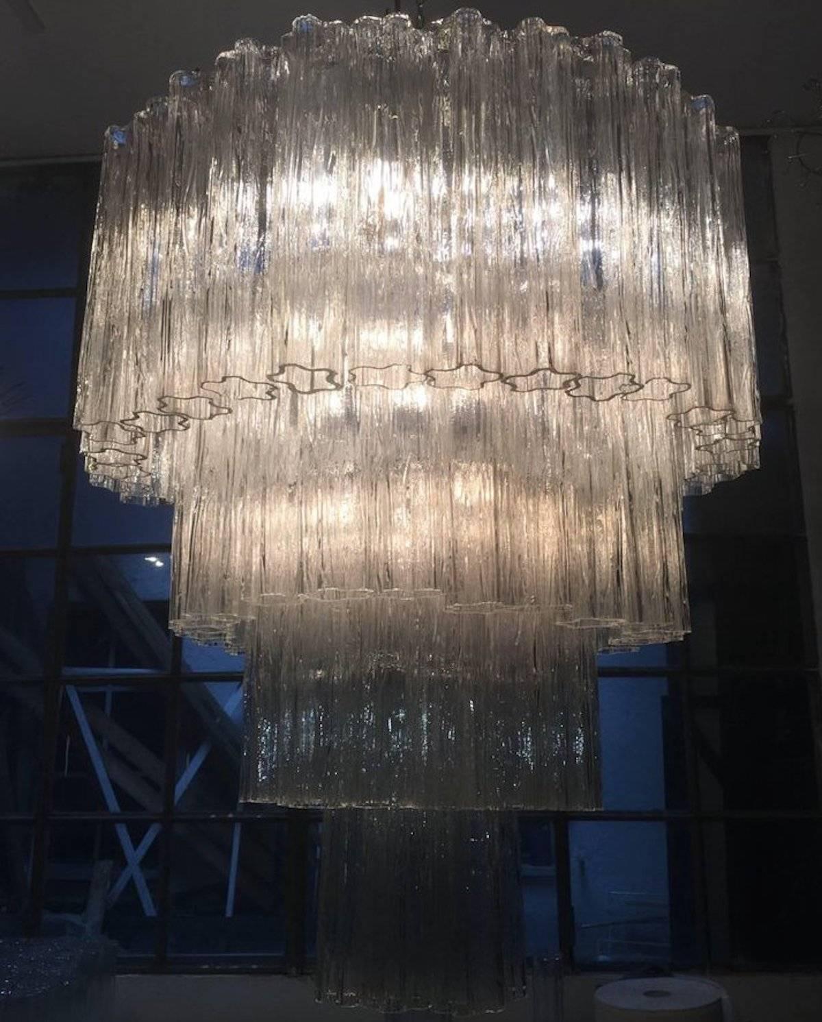 This extraordinary pair of chandeliers is composed by 78 'Tronchi' by 45 cm high.
18 light bulbs E 14.
Height 110 cm without chain we can extend the height to 125 cm adding another 'tronchi' glass to the last level.
 

