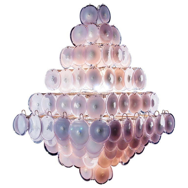 A chandelier of rare beauty and elegance. 136 Murano glass discs amethyst by Gino Vistosi, disposed in ten rows, forming two overlapping pyramids.
Available also with white and amber discs. 