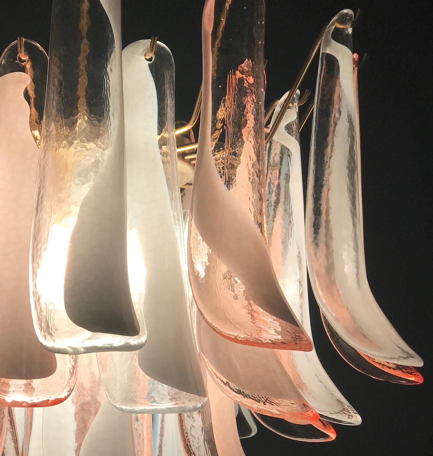 Charming Italian chandelier made by 50 glass petals (pink and white lattimo).
Measures: Height with chain cm 80, without chain cm 55 diameter cm 65.