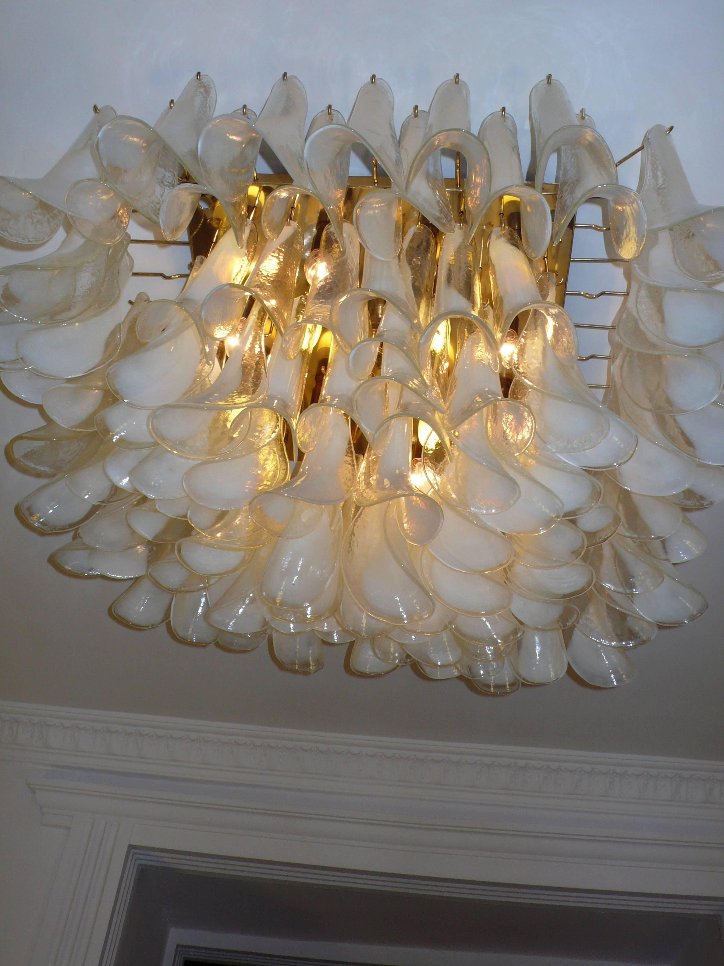 Spectacular chandelier 126 petals blown glass by Murano. 

Available two item.