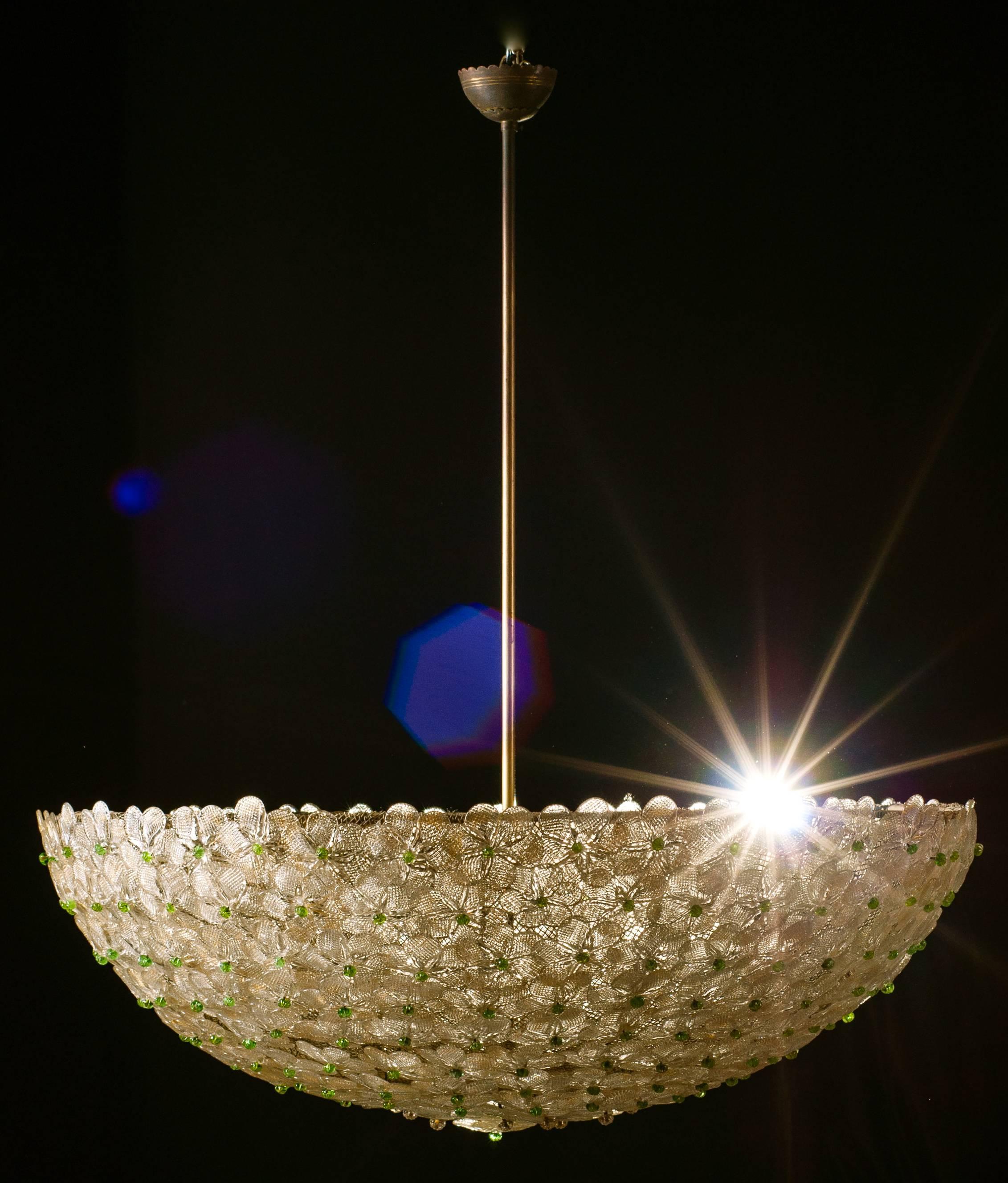 Extraordinary ceiling lamp in the shape of an inverted umbrella. And it composed of hundreds of small roses in glass Murano.

Diameter of 80 cm, height of 40 cm without the rod, with rod 110 cm.

Without the rod can be used as ceiling.