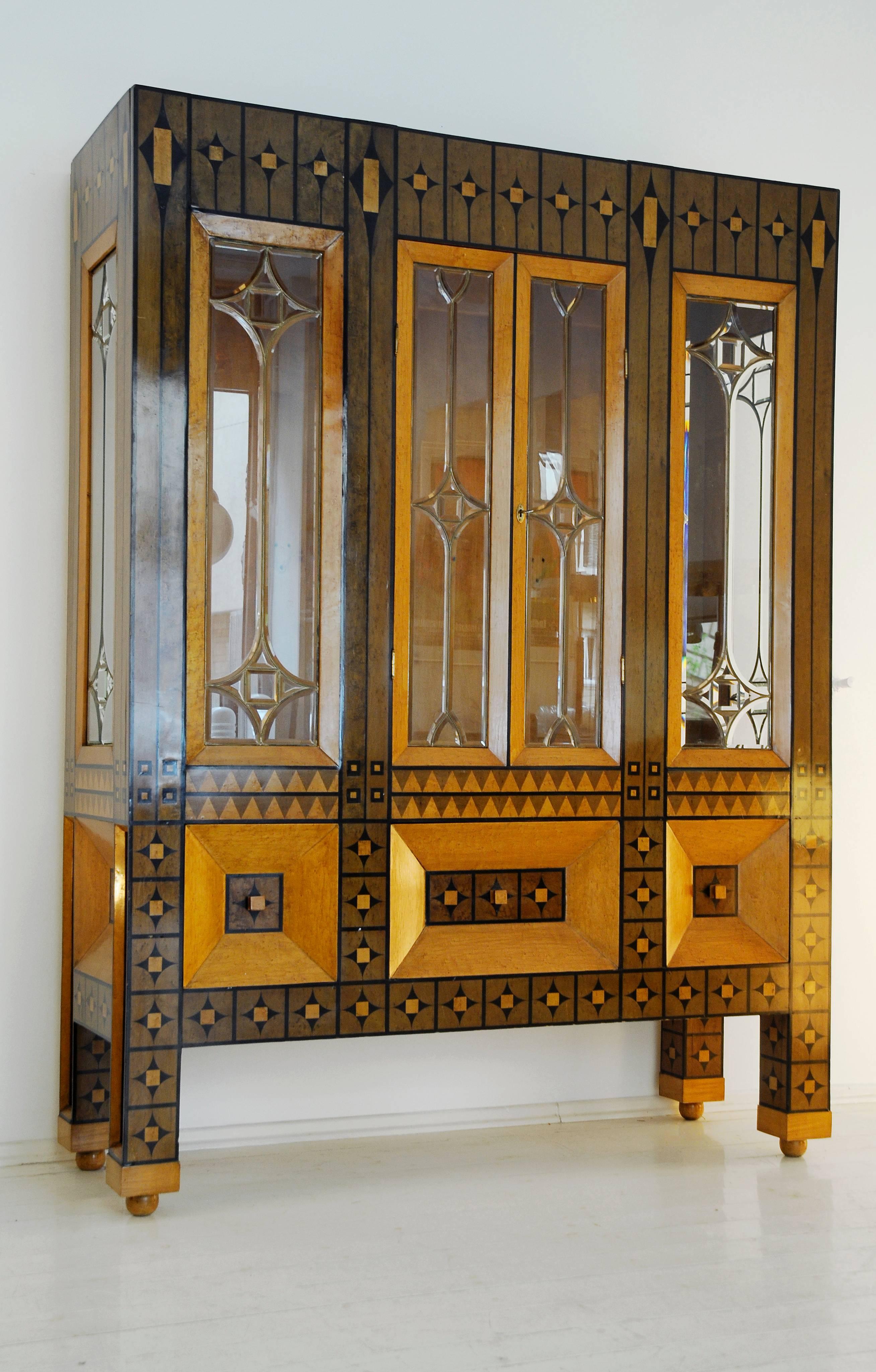 
Historically important display cabinet.

School of Koloman Moser.

1st quarter of 20th century.

Materials:

Solid wood base, etched glass, brass, fruit wood inlay, ebonized wood.

Original good condition, minor defects due to the