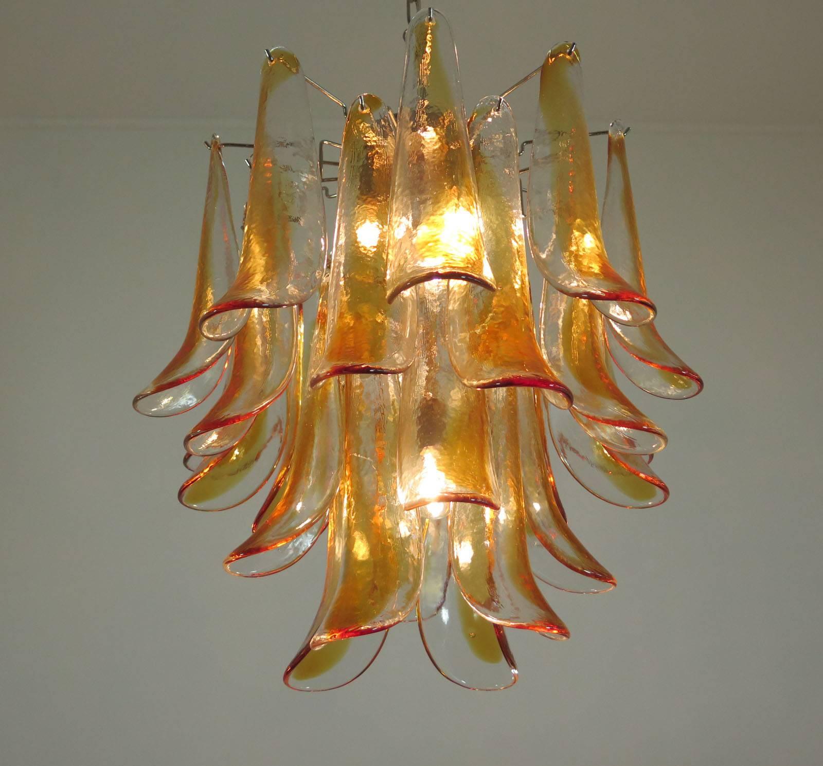 Italian vintage Murano chandelier made by 26 glass petals (transparent and amber) in a chrome frame. Dimensions: 47.25 inches (120 cm) height with chain; 23.62 inches (60 cm) height without chain; 19.70 inches (50 cm) diameter. Dimension glasses: