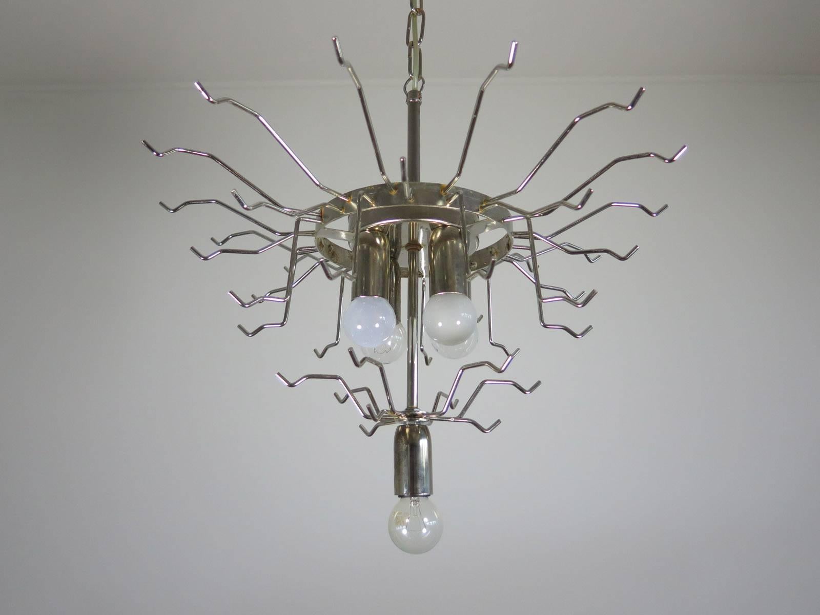 Huge Italian vintage Murano chandelier made by 42 glass petals (transparent and white “lattimo”) in a chrome frame.
Dimensions: 46 inches (117 cm) height with chain; 25.
Dimension glasses: 11.40 inches (29 cm) height; 3.15 inches (8 cm) maximum
