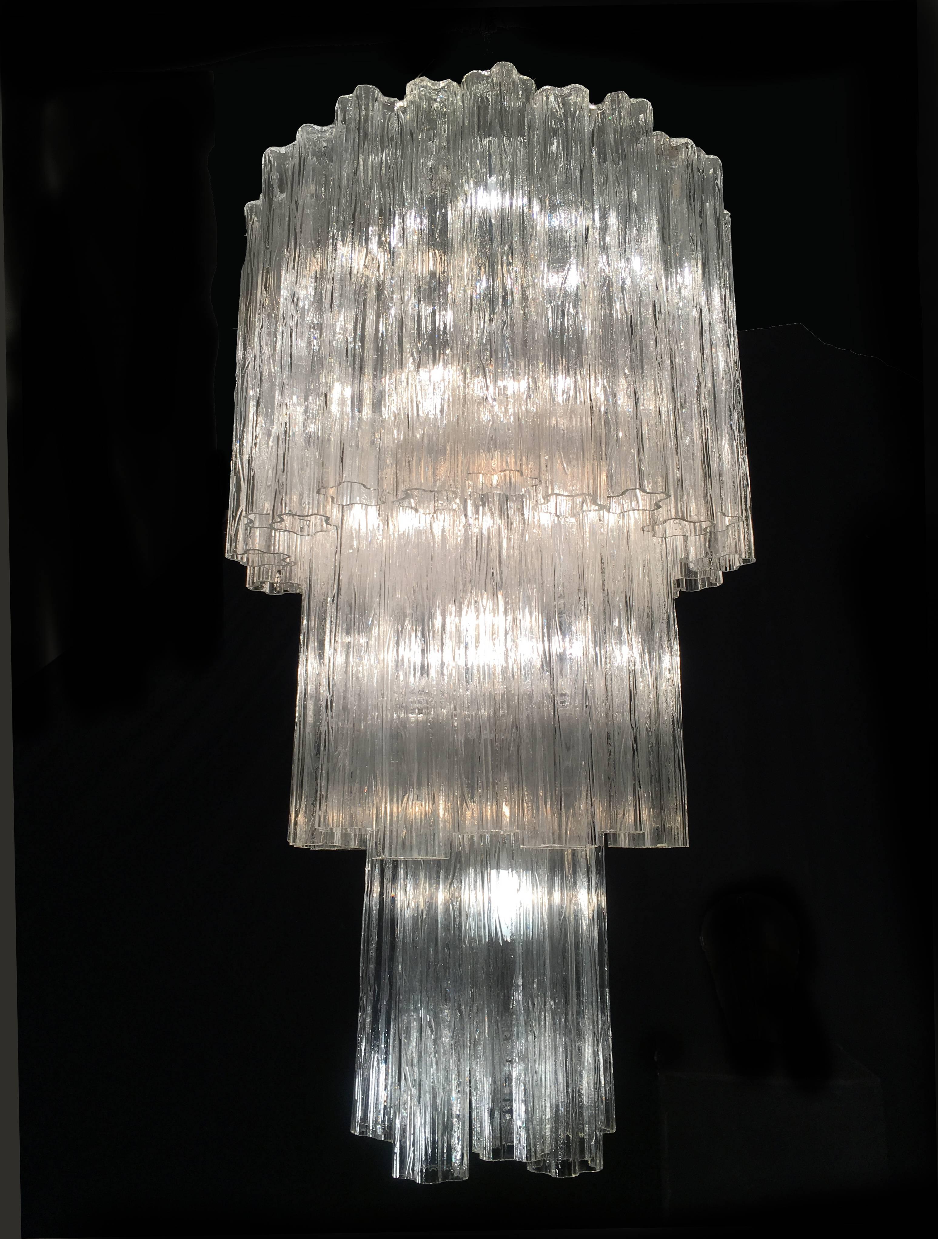 Each chandelier includes precious 48 tronchi Murano glass 50 cm long. 
Measures: Diameter 60 cm, height 115 cm. 16 lights.