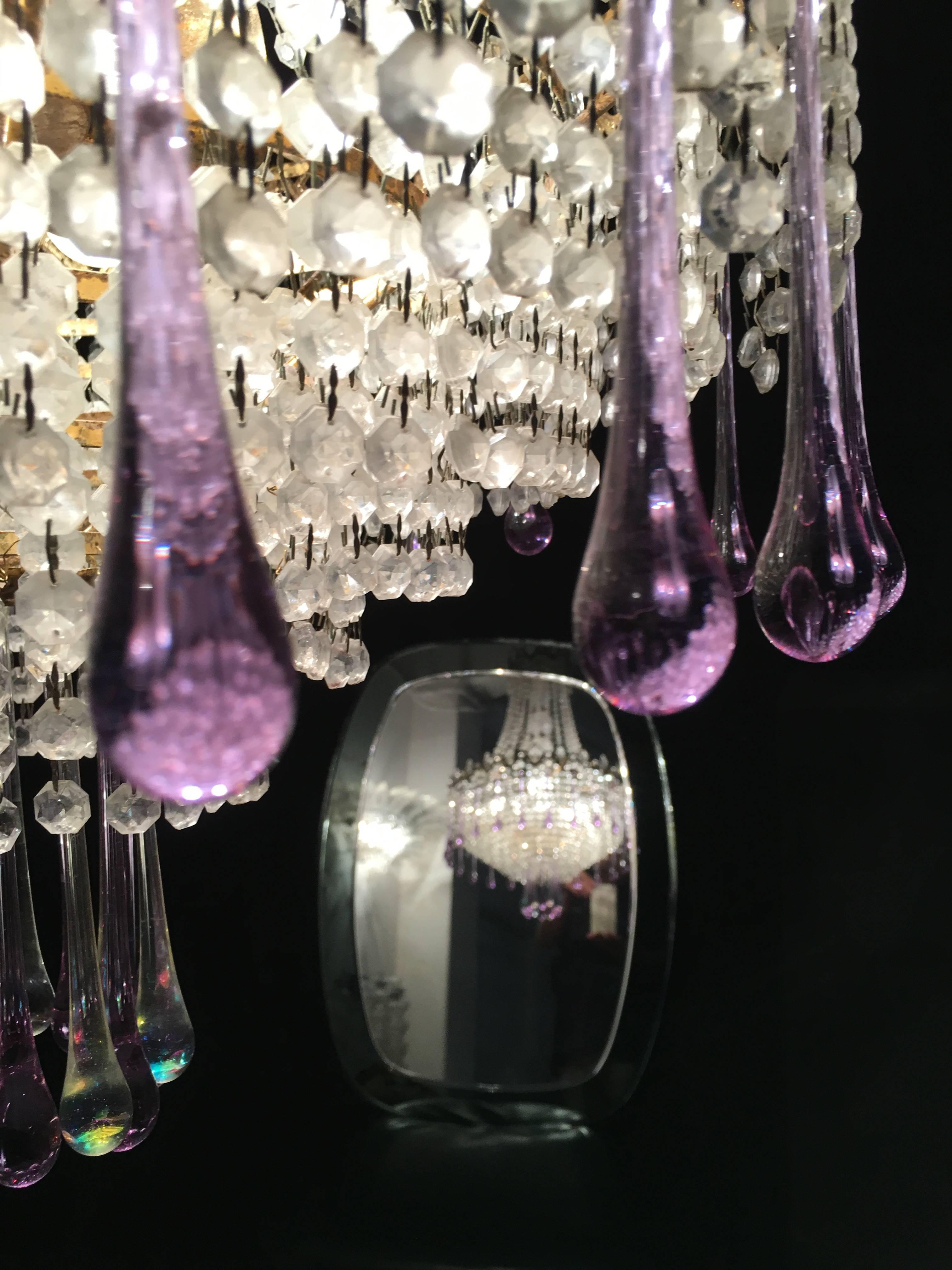 Charming chandelier white Murano drops.
