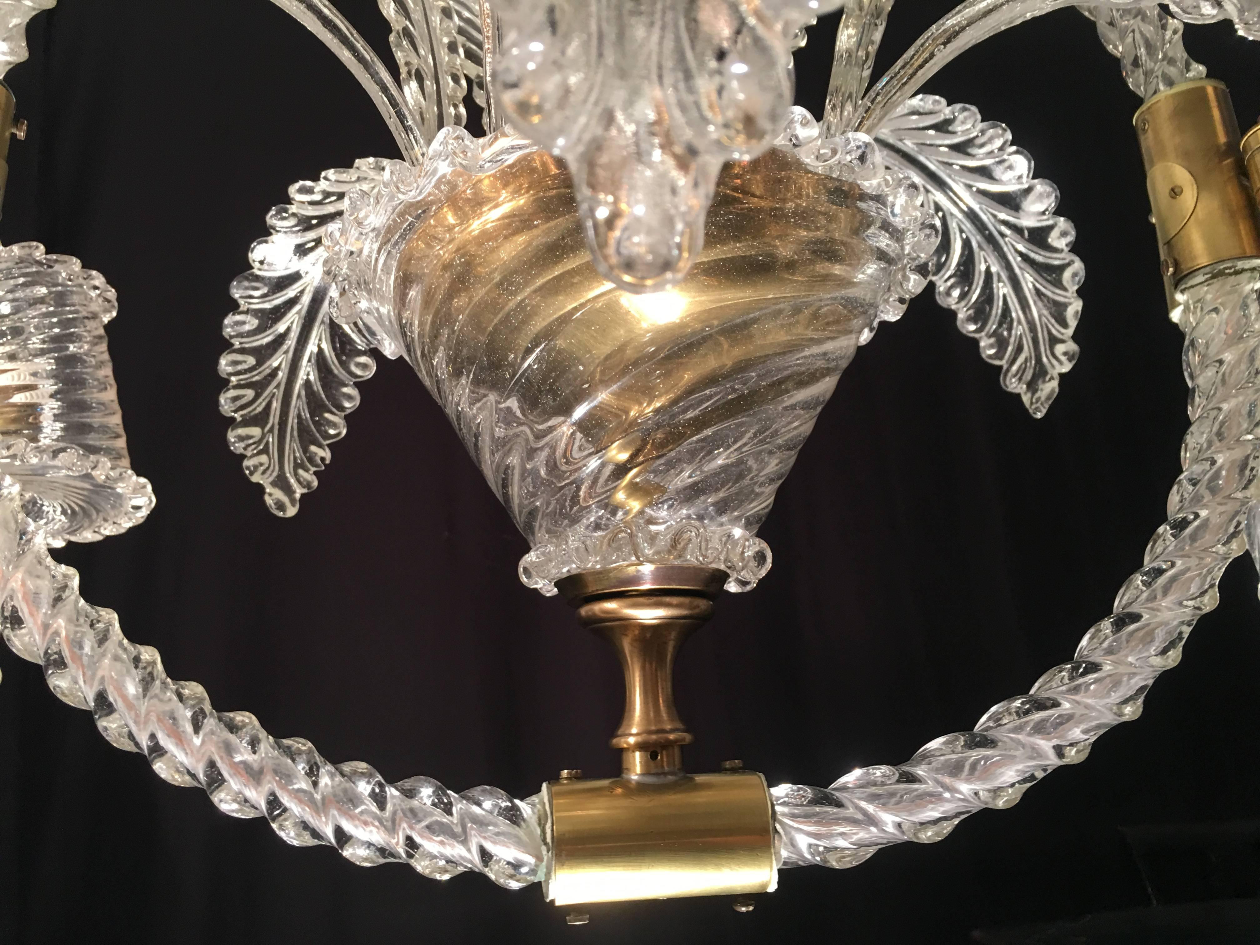 Wonderful Liberty chandelier made ​​around the year 1940 to the Murano glass factory by Ercole Barovier. Four large cups and 18 eaves.