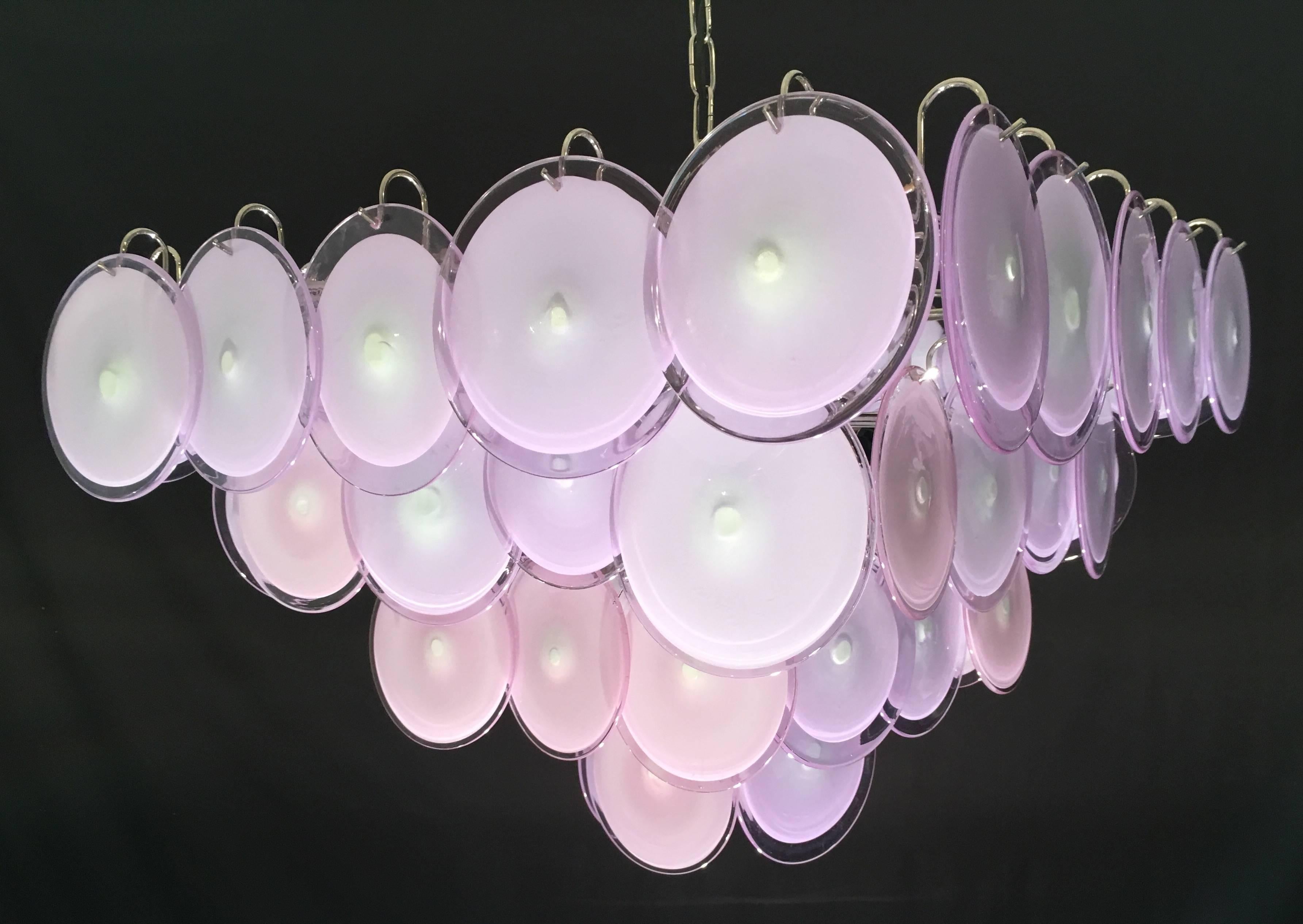 Each chandelier is made of 50 discs of precious Murano glass are arranged on four levels.
 Nine light bulbes E 14.