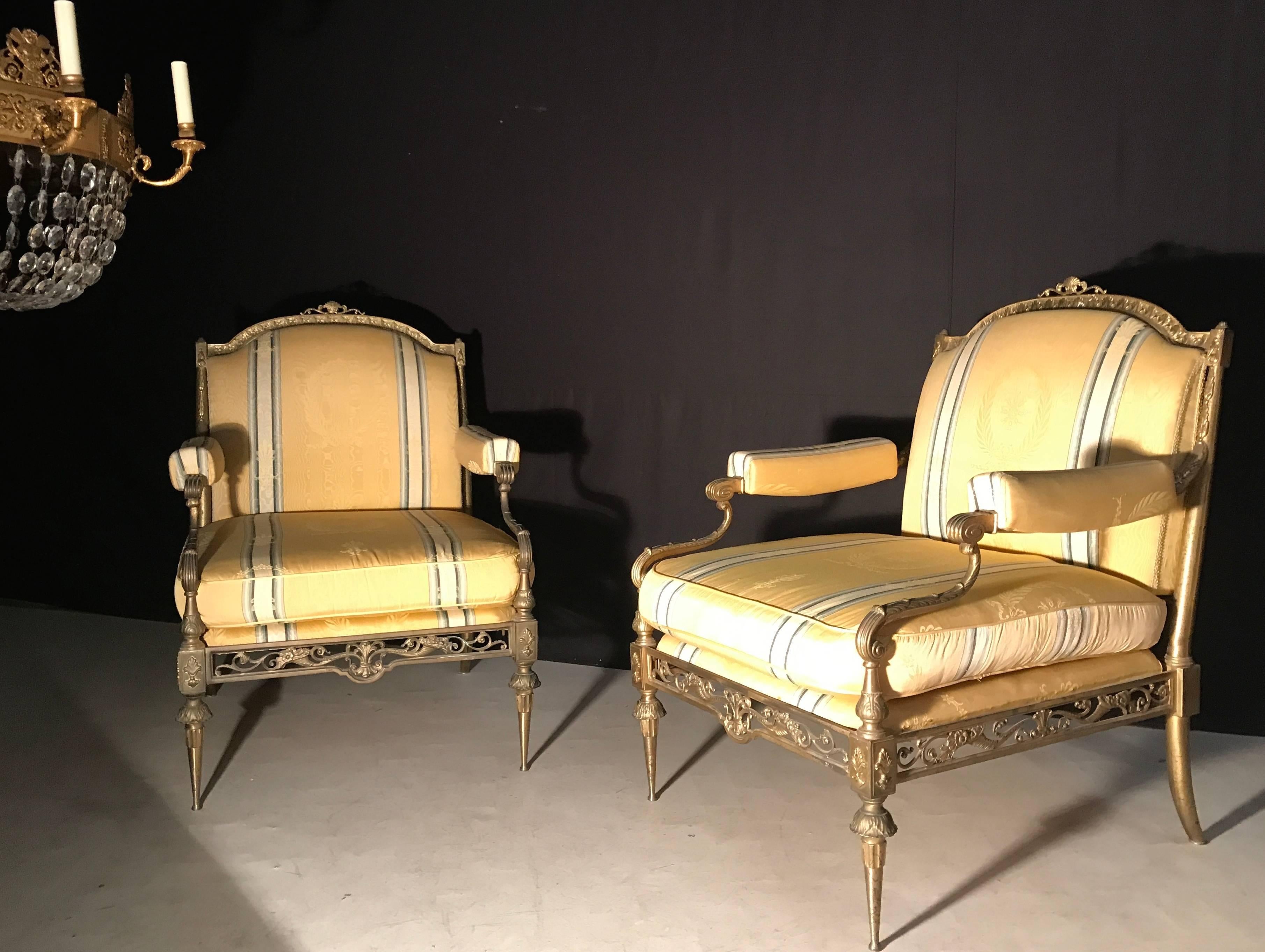 Exceptional pair of gilt bronze armchairs with yellow silk upholstery.
To complete the set a sofa is also available.
 