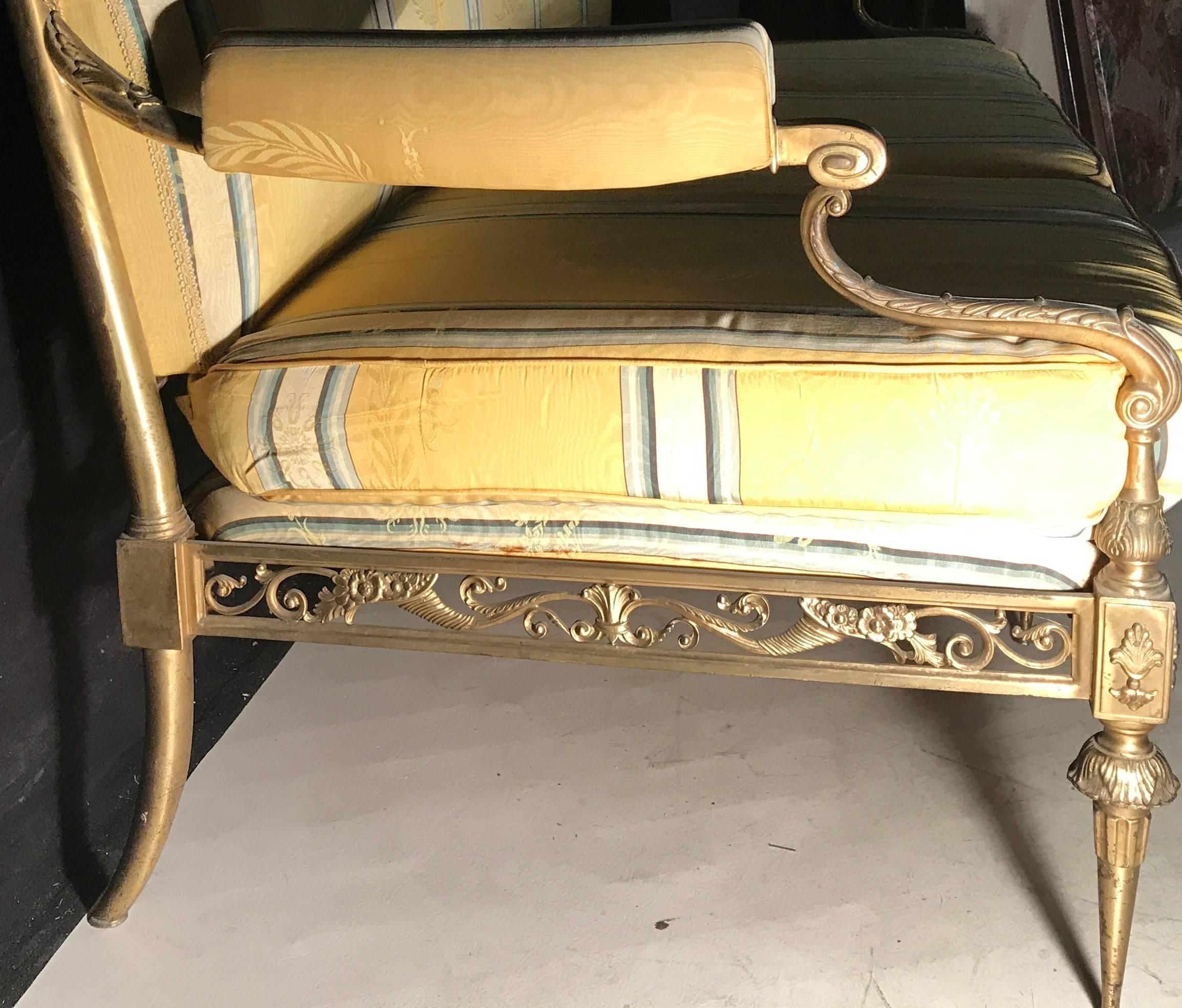 Exceptional Italian gilt bronze sofa with yellow silk upholstery.
The pair of armchairs are also available.