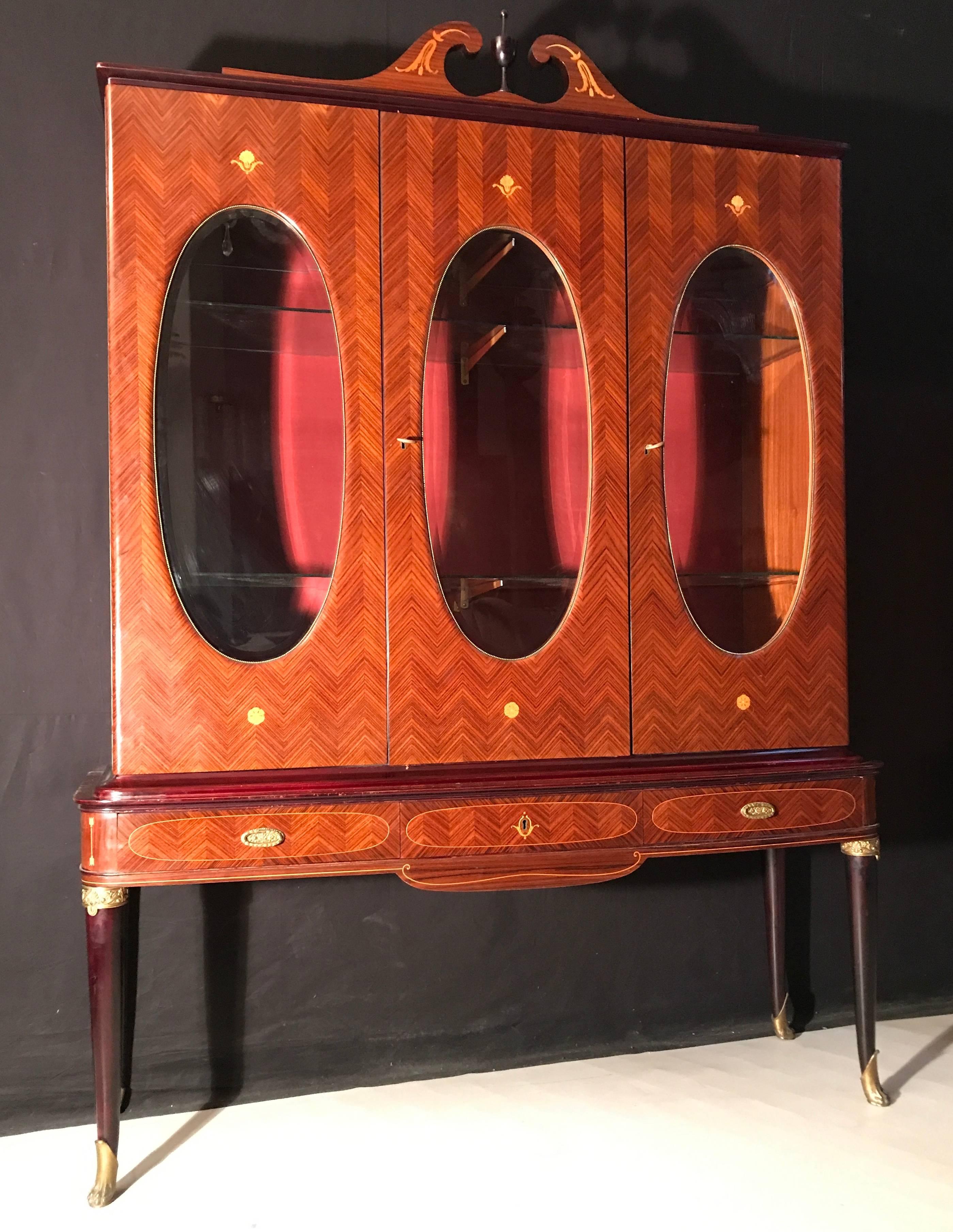 Ormolu-mounted, carved and inlaid with rare woods.
 