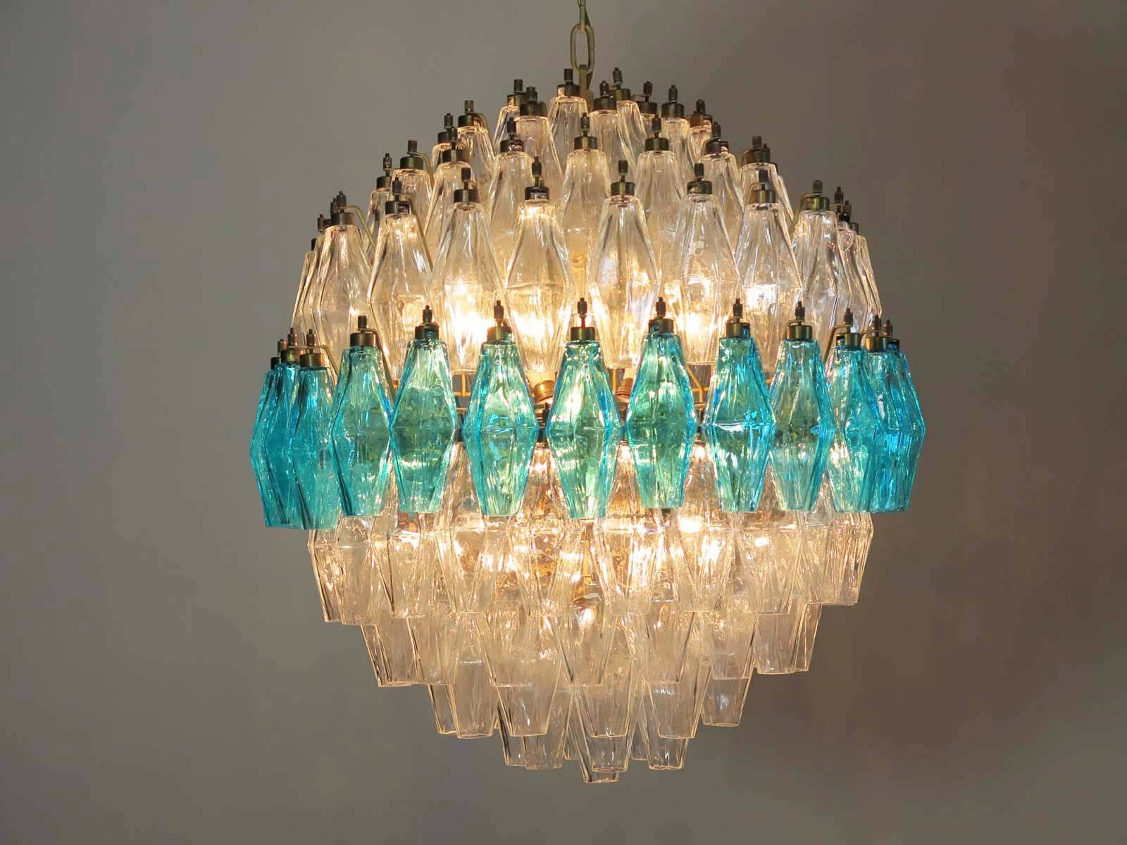  composed by 140 polyhedral-shaped glass pendant, ice and 'Acquamarina' color.
Measures: Height without chain is 75 cm with chain is cm 130
Diameter cm 60.
