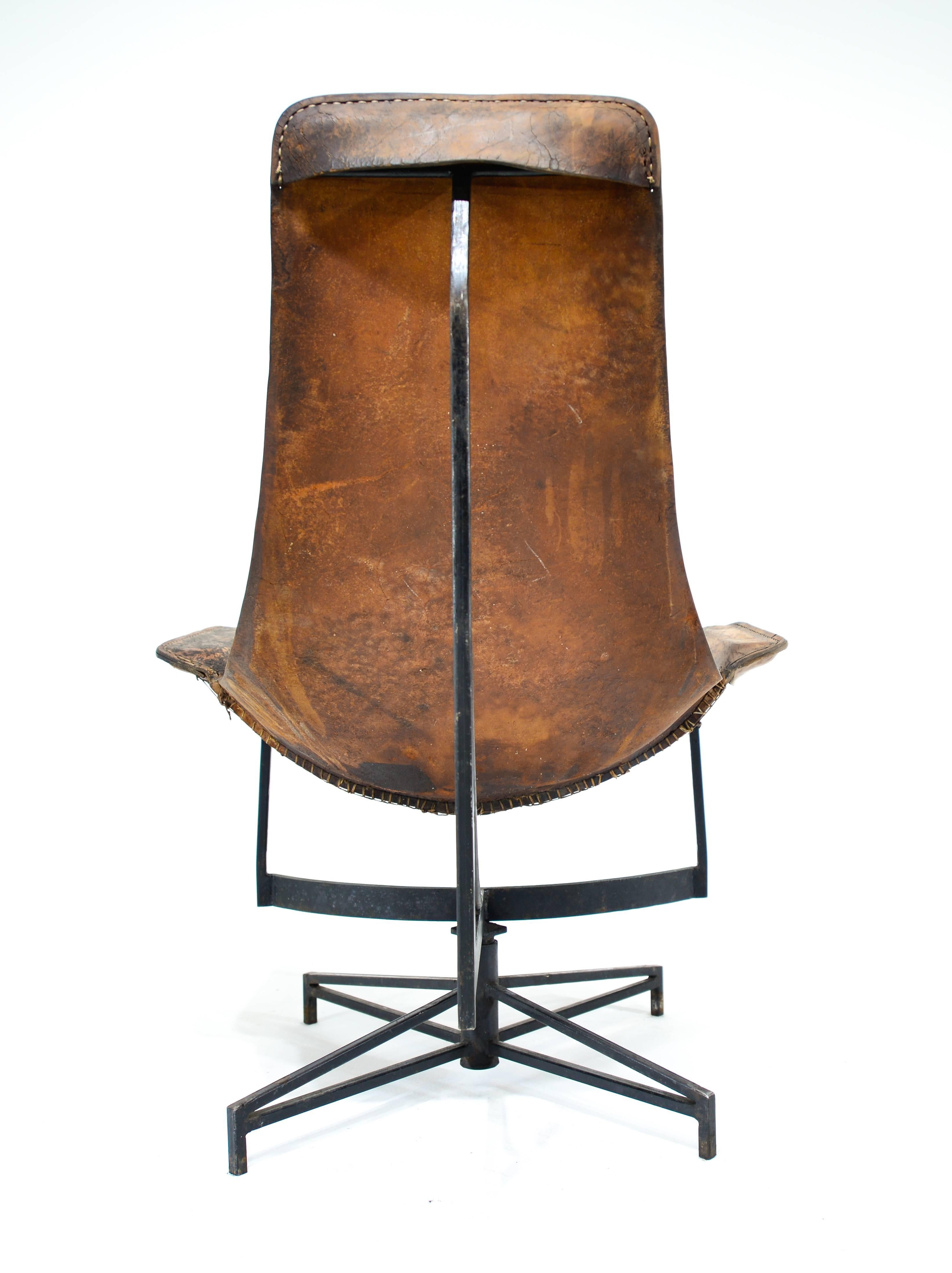William Katavolos swiveling leather sling chair.
