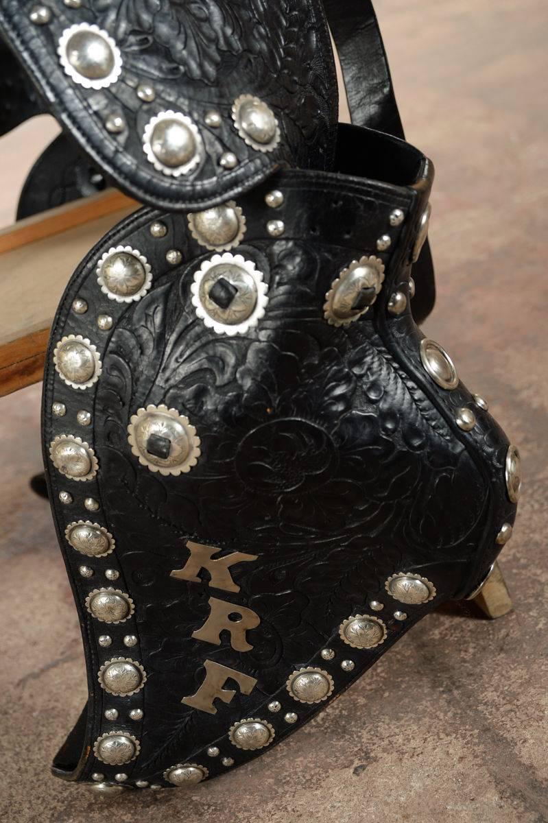 Olsen Nolte -Gorgeous Black Hand Tooled Leather & Sterling Parade Saddle Set c.1938

Olsen Nolte Parade Saddle Set -- Black Hand Tooled Leather with Sterling Silver Conchos .Rare exceptionally crafted parade saddle. This was used in the Pasadena