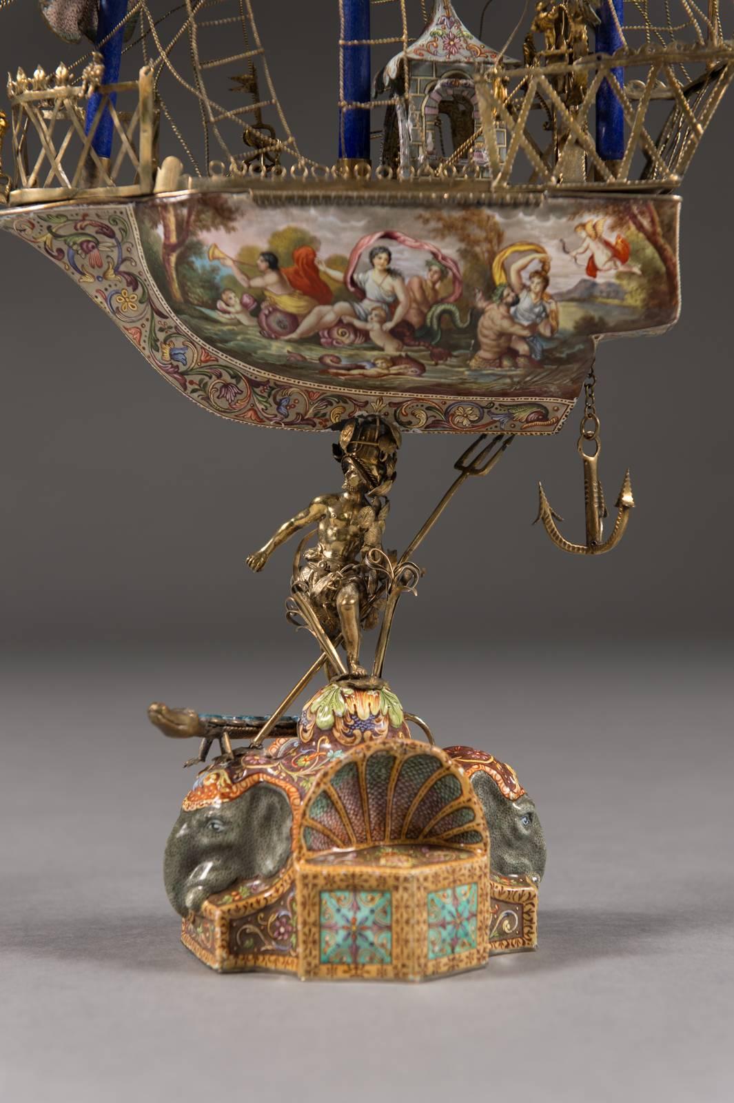
A Very Fine Viennese parcel-gilt silver and enamel sailing ship by Rudolf Linke,
Vienna, circa 1885-1903.

The silver enameled vessel supported on the back of the Greek mythological figure Poseidon. The base with two elephant heads and a