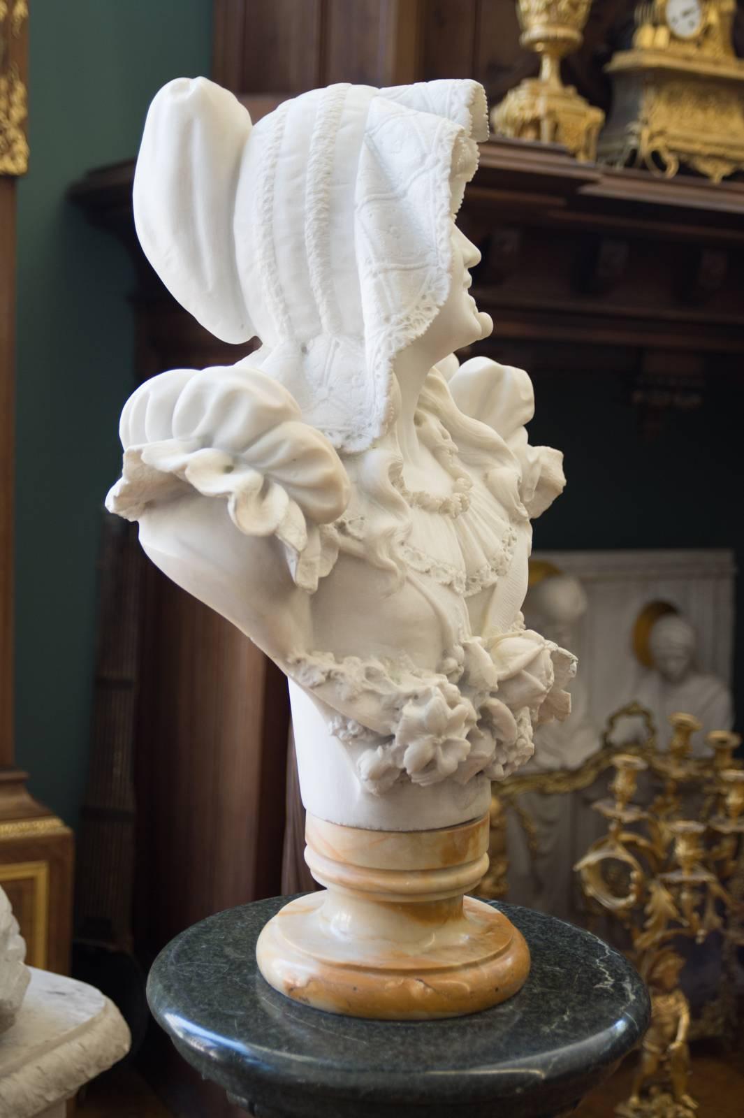 A charming late 19th century Italian Carrara marble bust of a smiling young woman.
The finely carved bust depicts a young woman wearing a large hat and a stem with 2 cherries in her mouth.

Circa 1890
