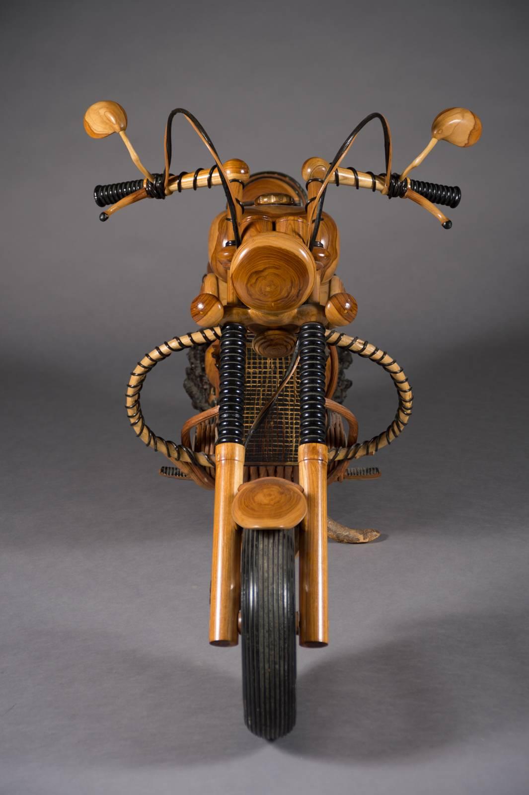 A fabulous life-size vintage carved wood model of a vintage Harley Davidson Chopper.

This remarkable piece of crafted art is 100% hand-carved wood.
There is intricate detail including thorough wiring, mufflers and side bags.
Everything from the