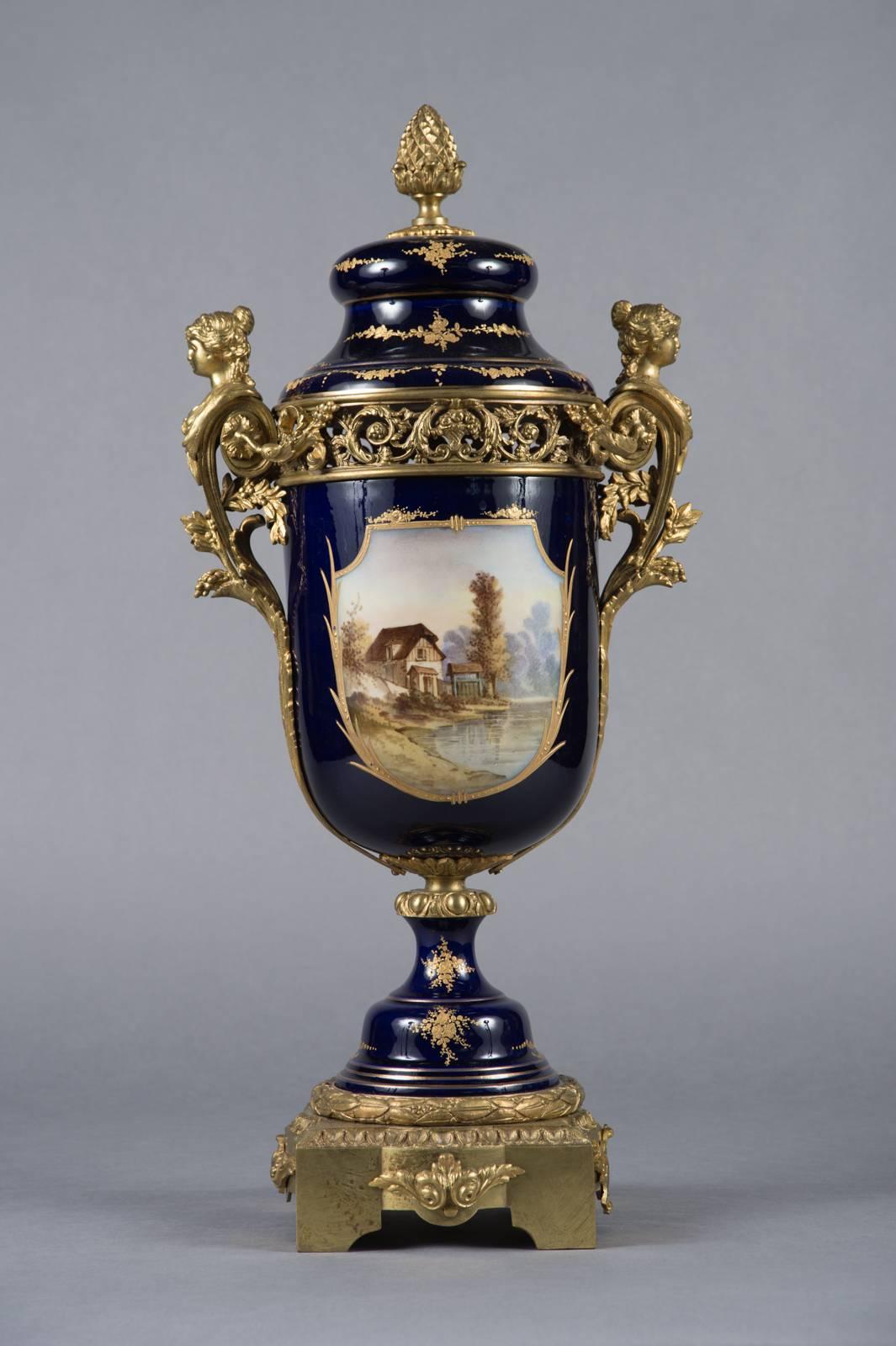 Louis XV Pair of 19th Century French Sevres Gilt Bronze-Mounted Cobalt Blue Lidded Urns For Sale