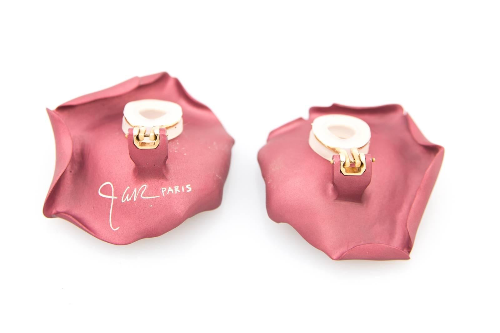 A pair of JAR gold and titanium rose petal earrings 

This is a rare pair of the signature 
