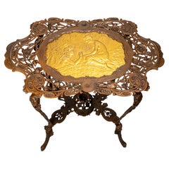 Antique Art Nouveau patinated and gilt cast iron side table