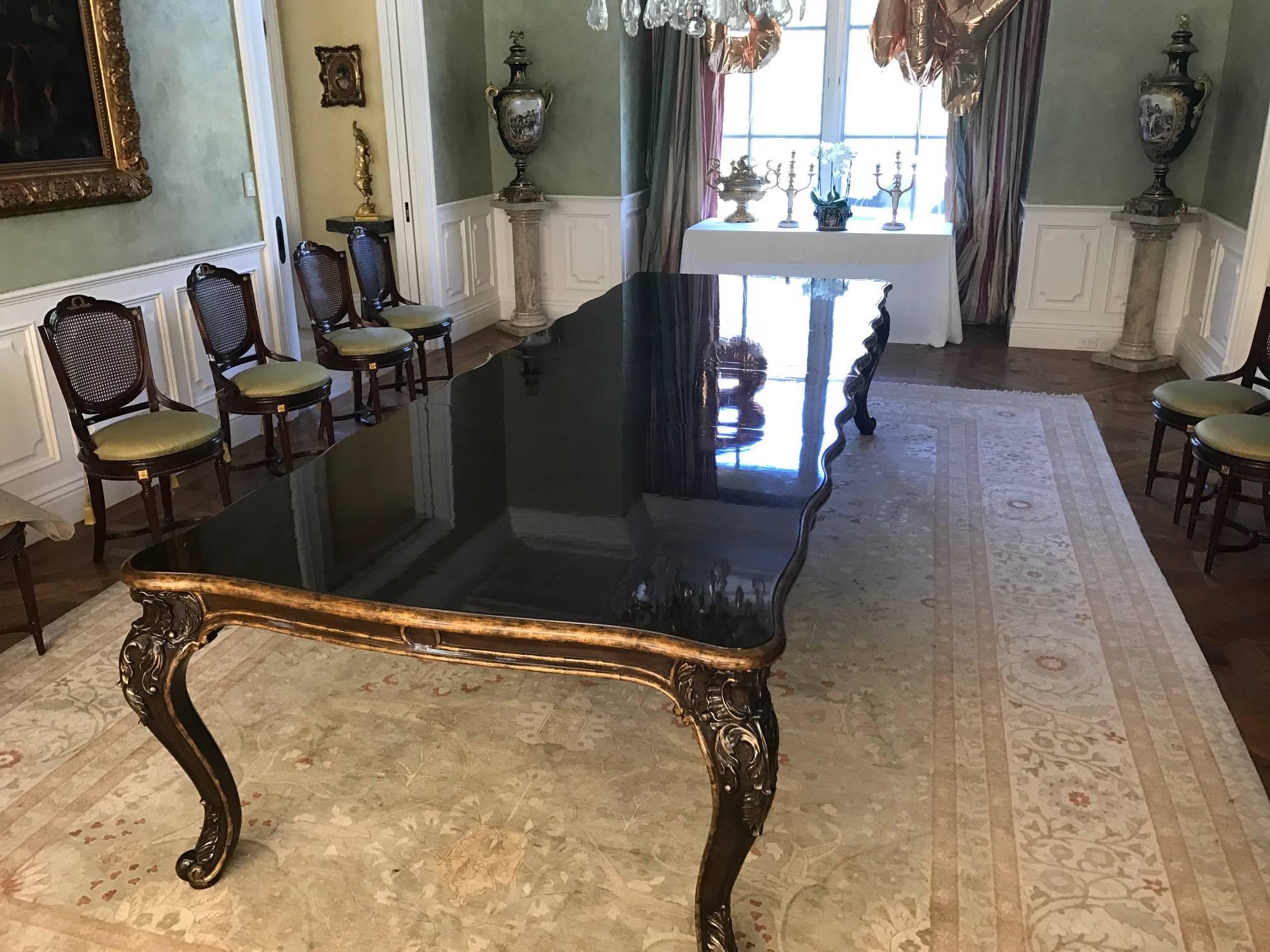 A large custom Marge Carson dining table two leaves

The table was custom-made in 2015 for a large Beverly Hills Estate. It has a shiny top which is in perfect condition. The room it was in was only for decoration so the table was rarely used.