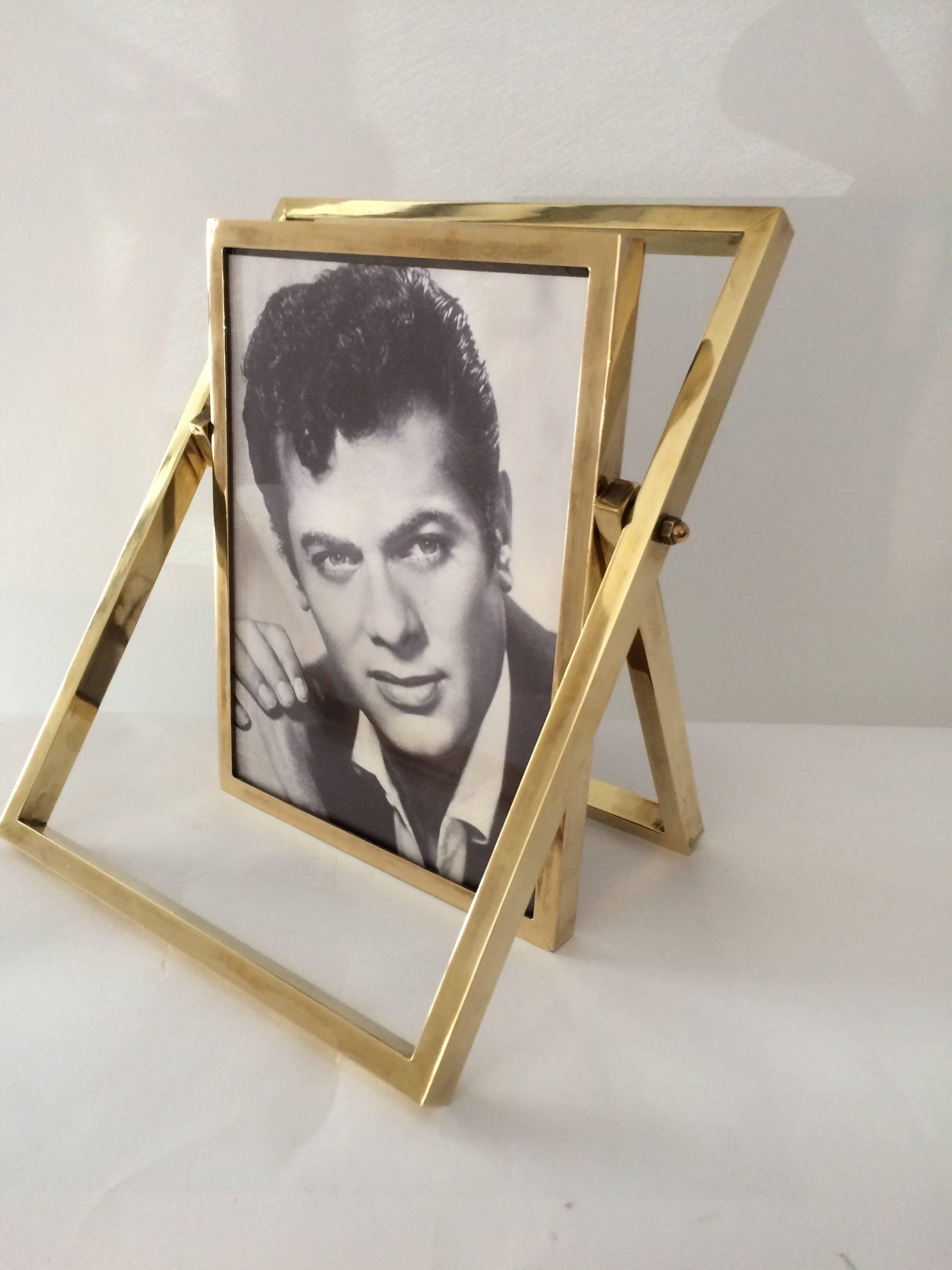 Most amazing and unusual French brass picture frame, 1970s. Can be adjusted to create different positions.