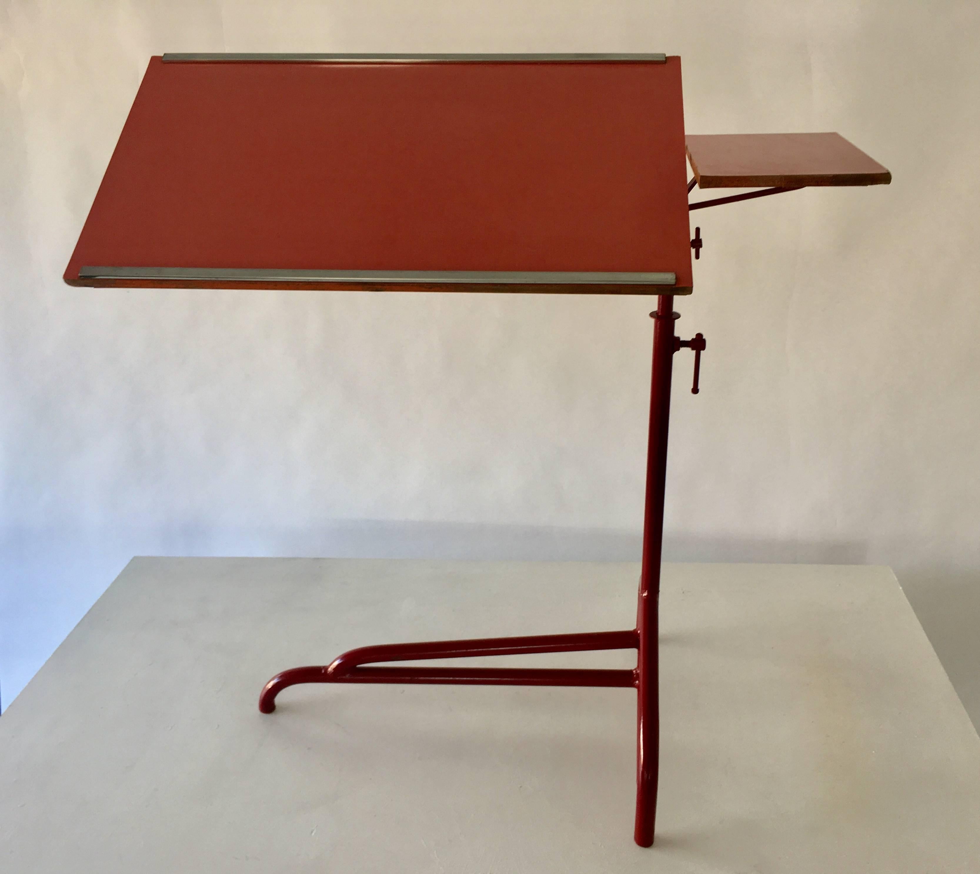 Jean Prouvé reading table for Martel de Janville Sanatorium, Plateau d'Assy, France, 1936. Enameled steel, laminate over wood, and chrome-plated steel. Table height can be adjusted up 20 inches higher.

Provenance: Martel de Janville Sanatorium,