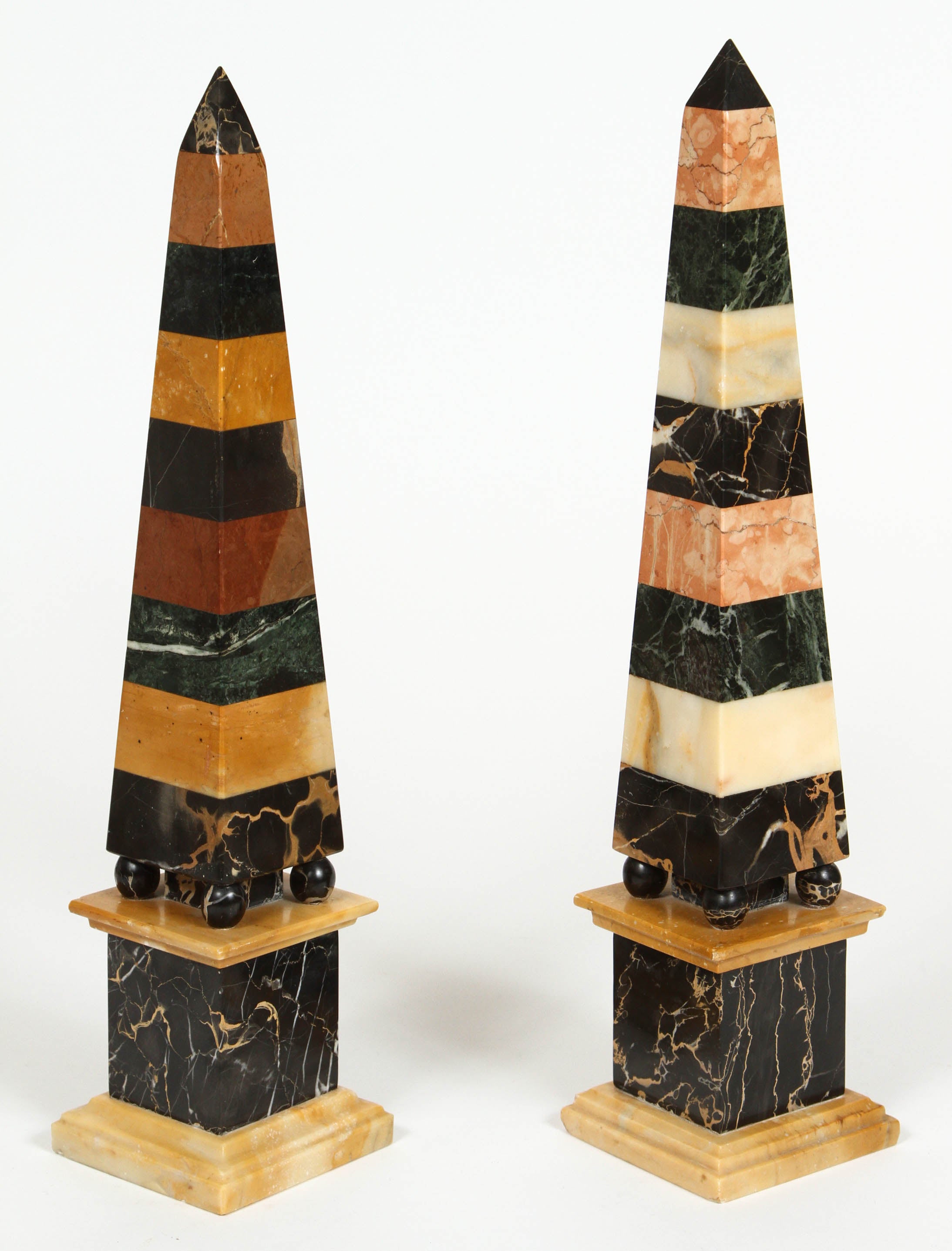 Pair of vintage marble obelisks on attached marble plinths.

Left: 17 3/8