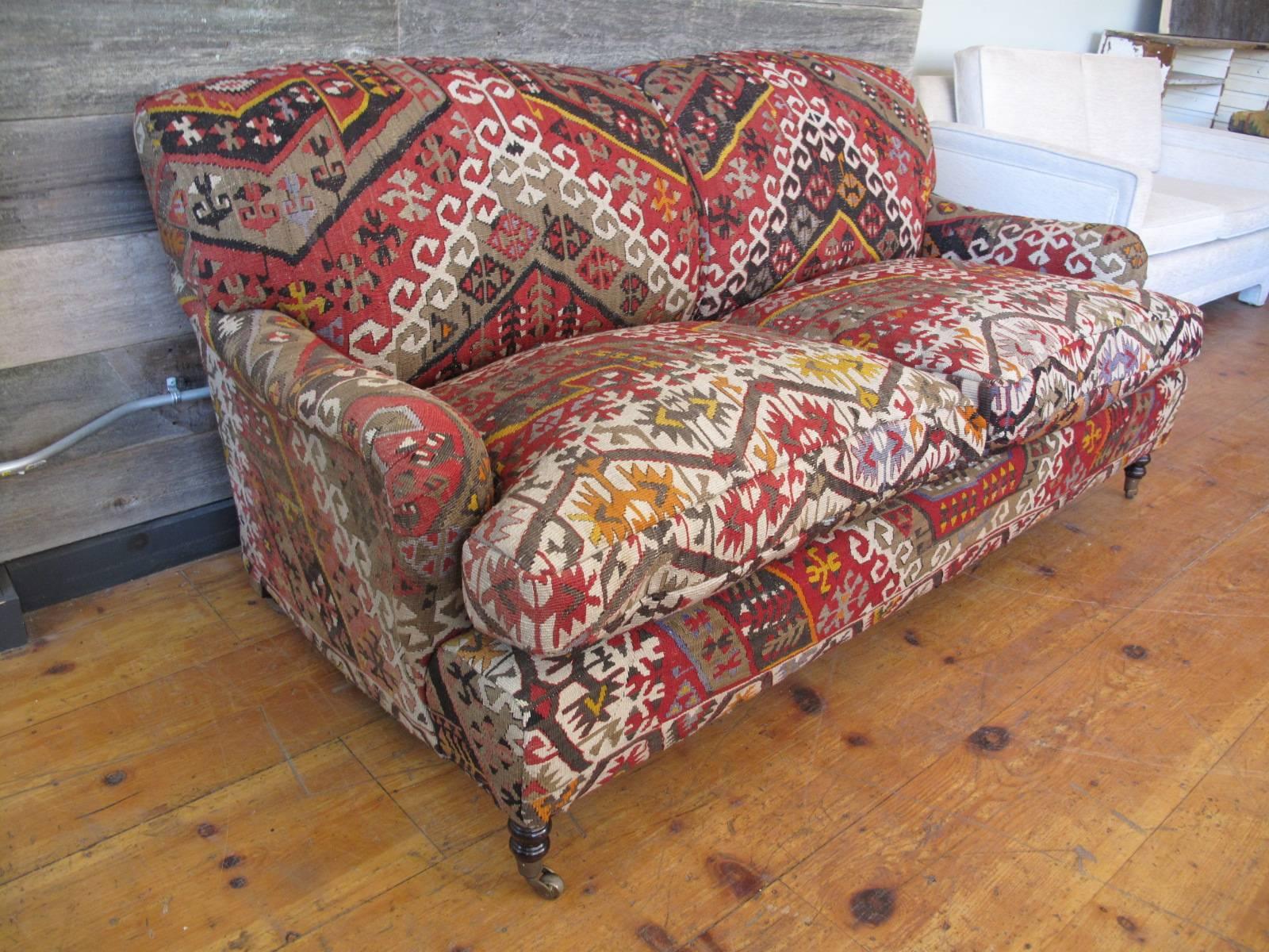 Standard George Smith roll arm sofa in vibrant flat-weave Kilim. Down cushions. Caster feet. Superb construction. Made in England.