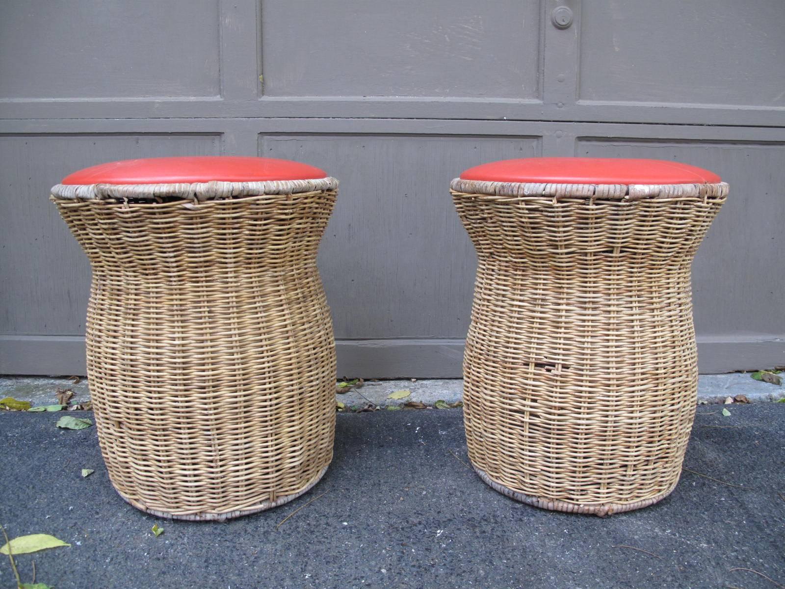 Calif-Asia wicker seats with red vinyl upholstery. Original tag on underside. Available as a pair.