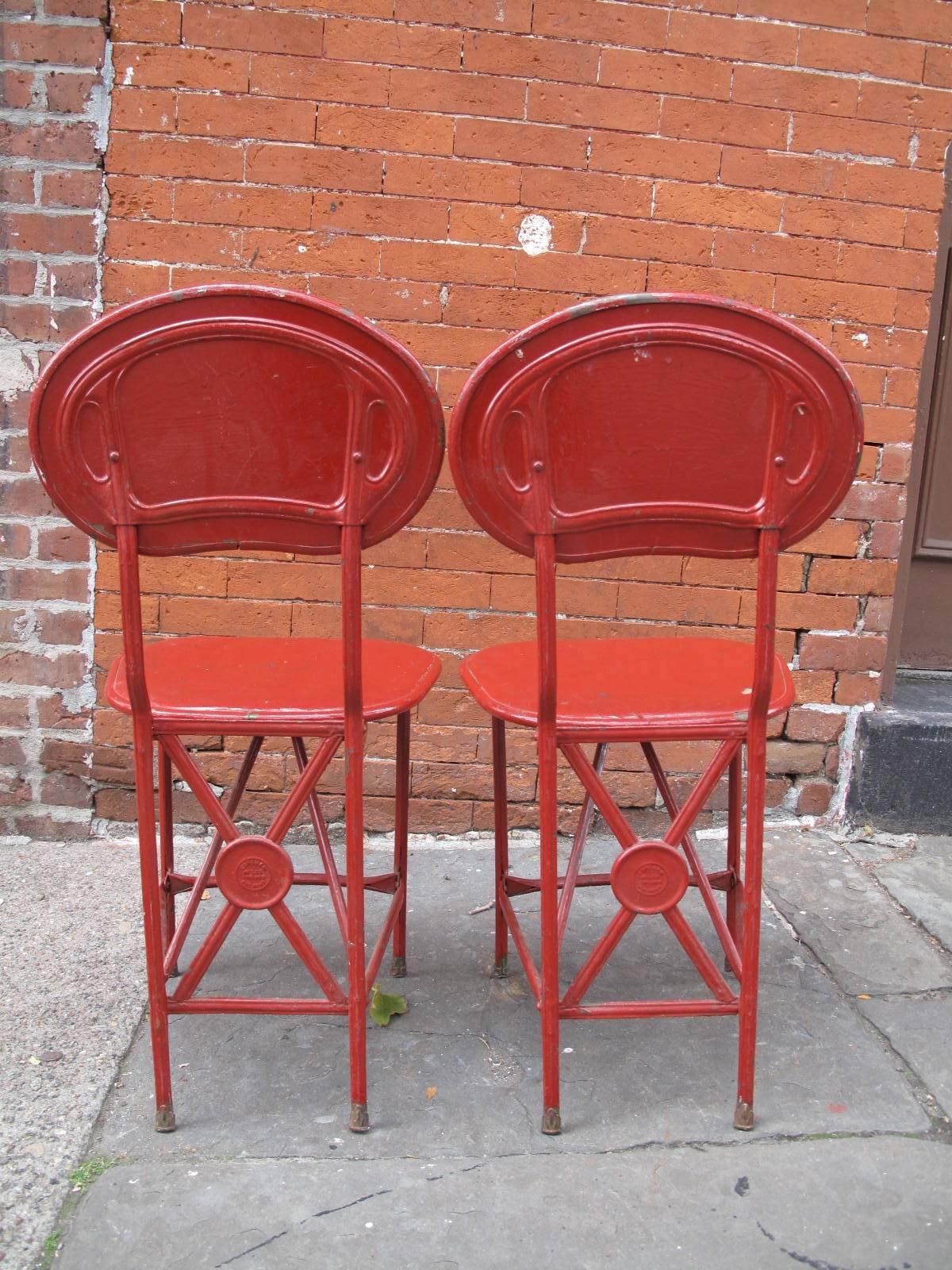 American made folding chairs with original red paint.
