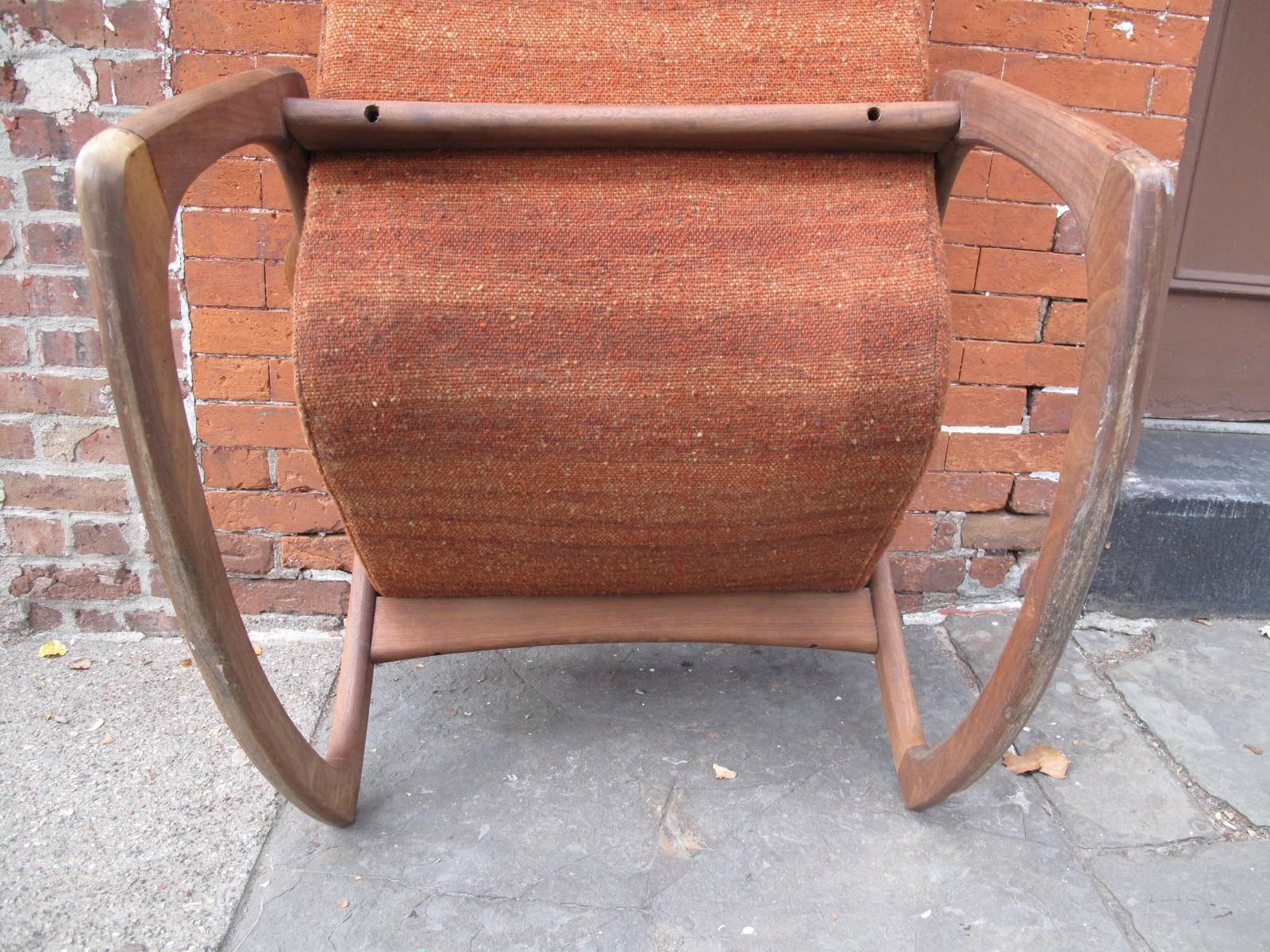 Original rust tweed upholstery. Unmarked. 