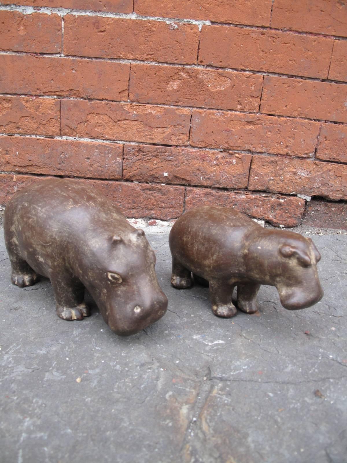 Two ceramic hippos - perhaps mother and baby. Each marked on the underside in silver paint with an underscored Z; Italy: A2050 and A2051, as shown in photos. Large hippo measures 5