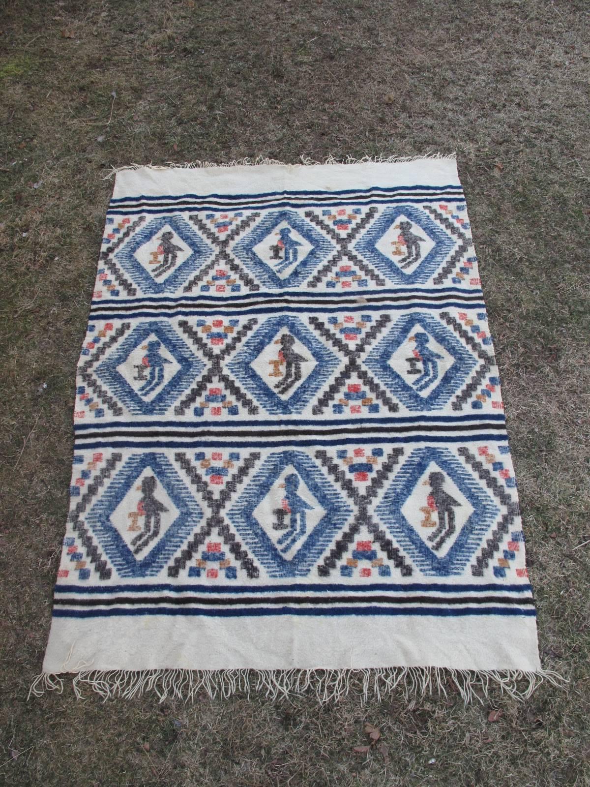 Handwoven wool throw. Five color pattern with perched bird motif. Unique geometric design. Possibly from Guatamala.