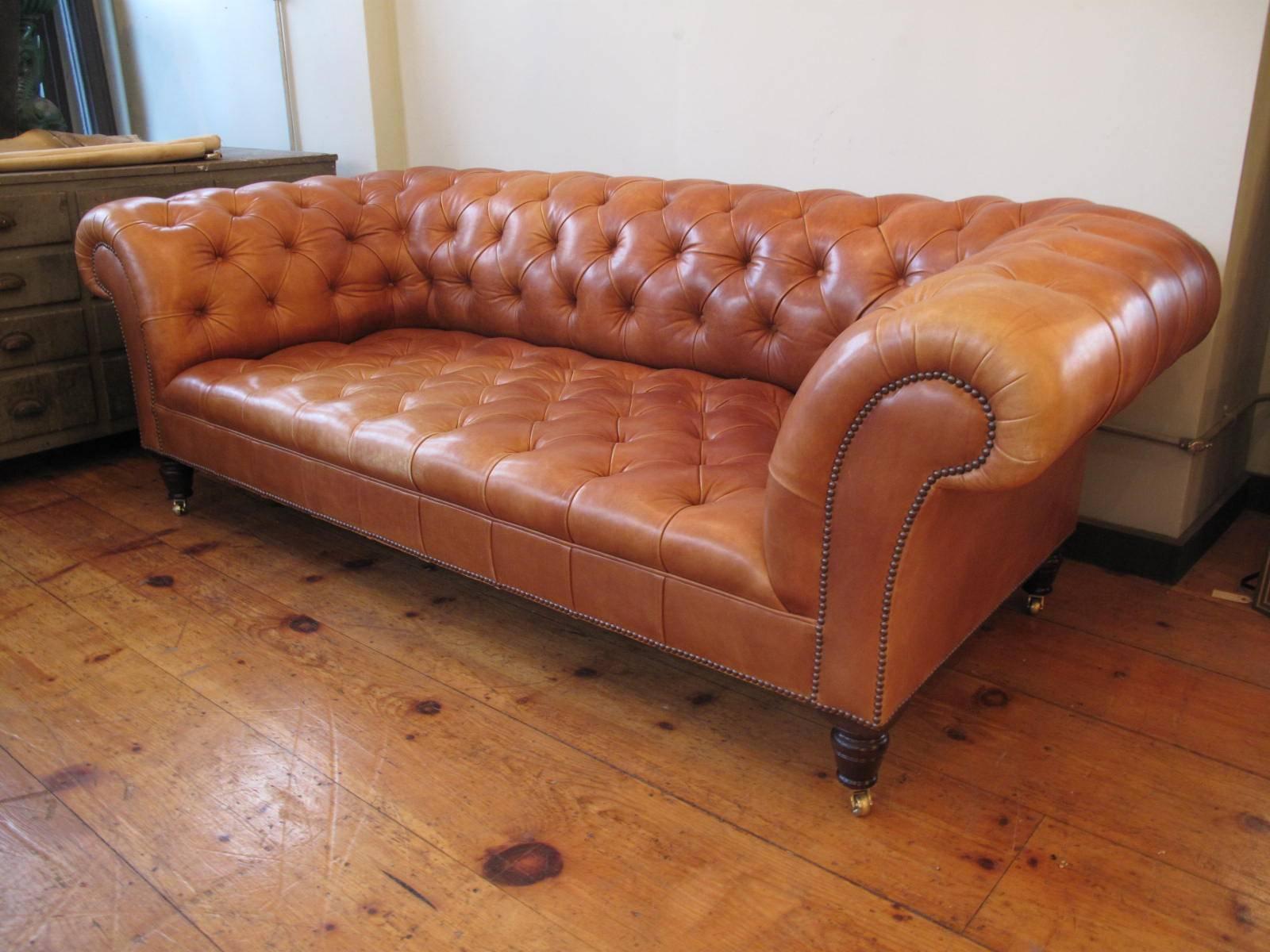 Tufted leather Chesterfield style sofa. By English fine furniture maker George Smith.