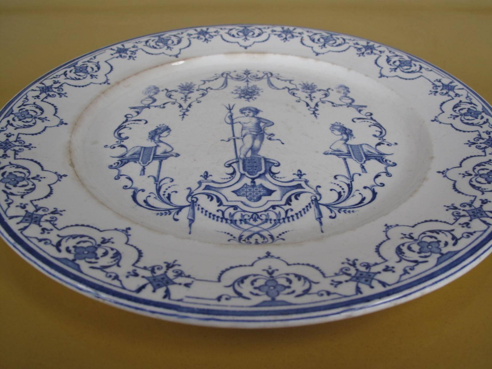 Clerissy faience platter. Early 1700s blue and white tin glazed earthenware. Decorations inspired by the engraver Jean Berain The Elder (1638-1711). Marked "Moustiers" with the distinctive date mark on underside as shown. 

From the
