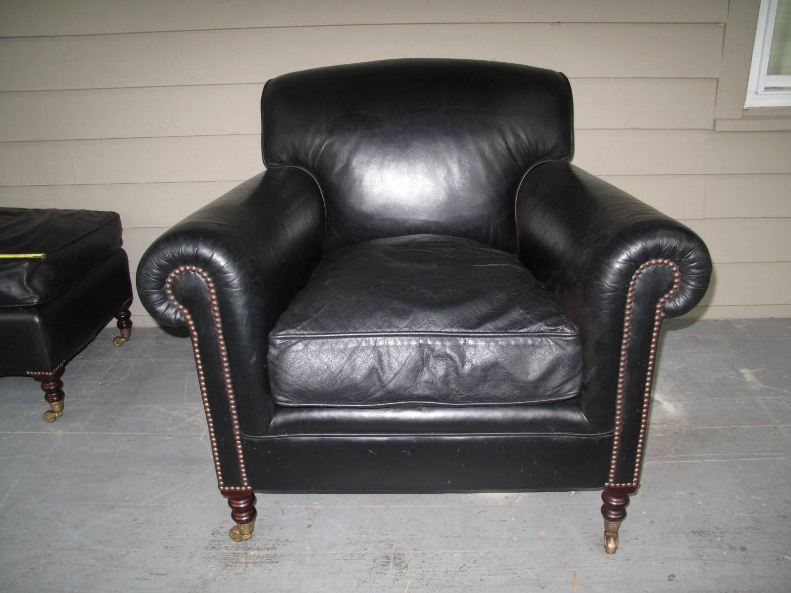 English made leather club chair, labelled George Smith. Casters on turned legs. Single down cushion. 

Ottoman measures:
21