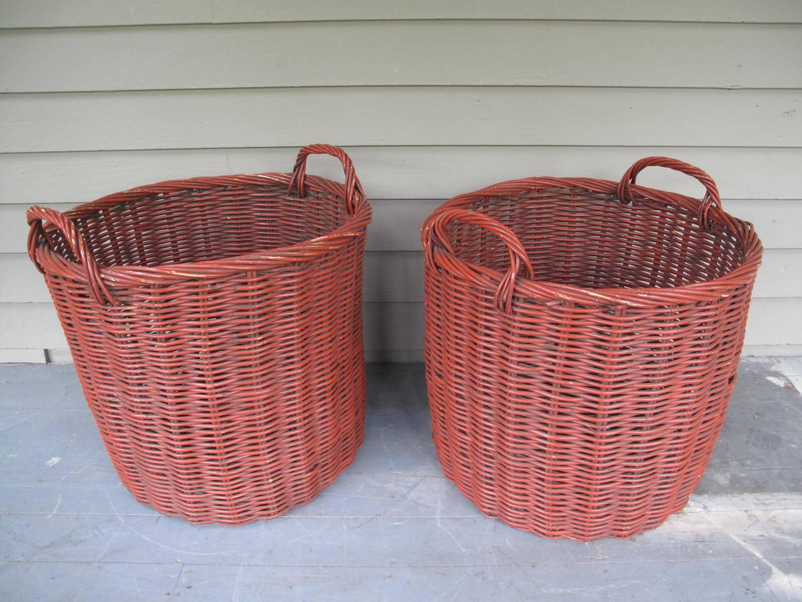 Enormous pair of handled baskets. Cylindrical form.