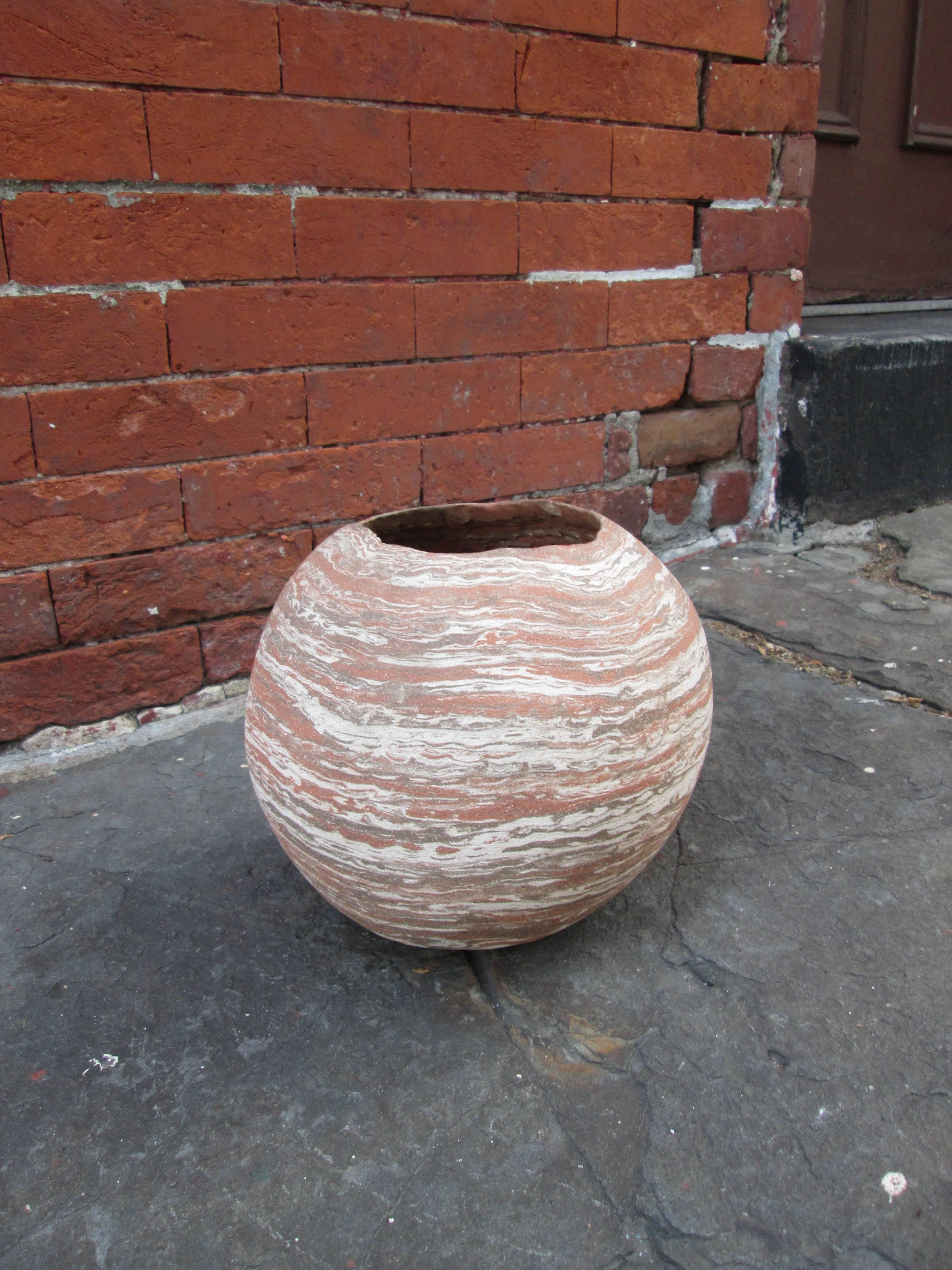 Orb shaped vessel in the manner of American pottery studio Niloak. Signed illegibly on base.