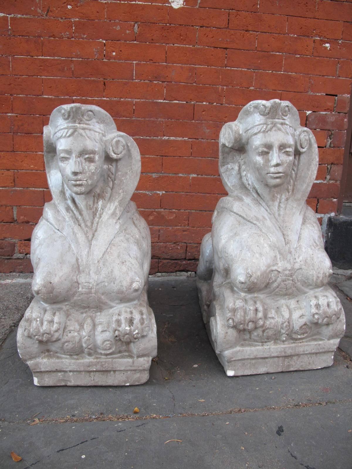 Two 20th century American statues of sphinx, similar to the sphinx at Belvedere Palace in Vienna, Austria. Mold made with faux finish.