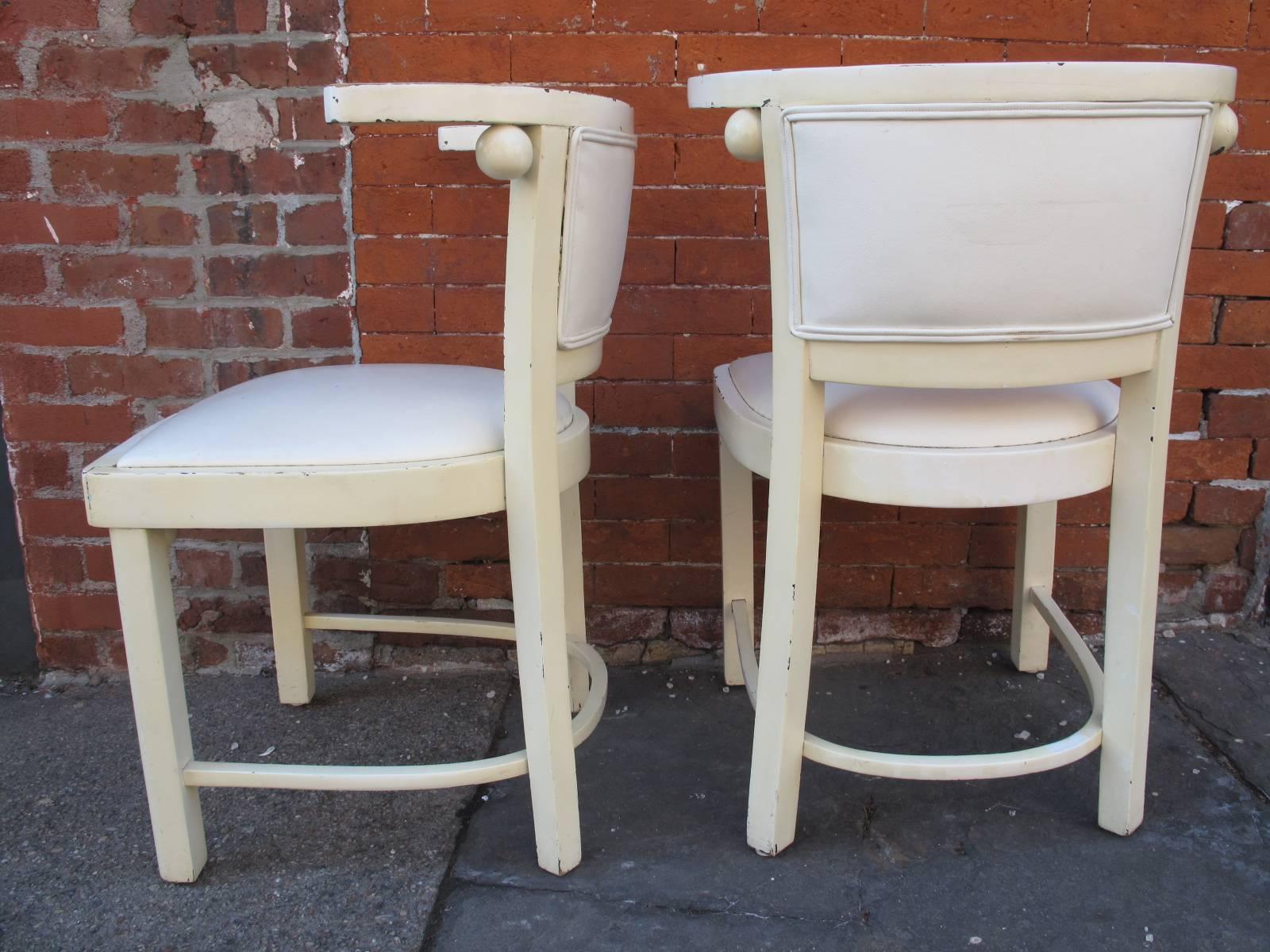Two side chairs in white lacquer in the manner of Josef Hoffmann. Seats and back appear to have been replaced and reupholstered in white vinyl. No label or makers mark.